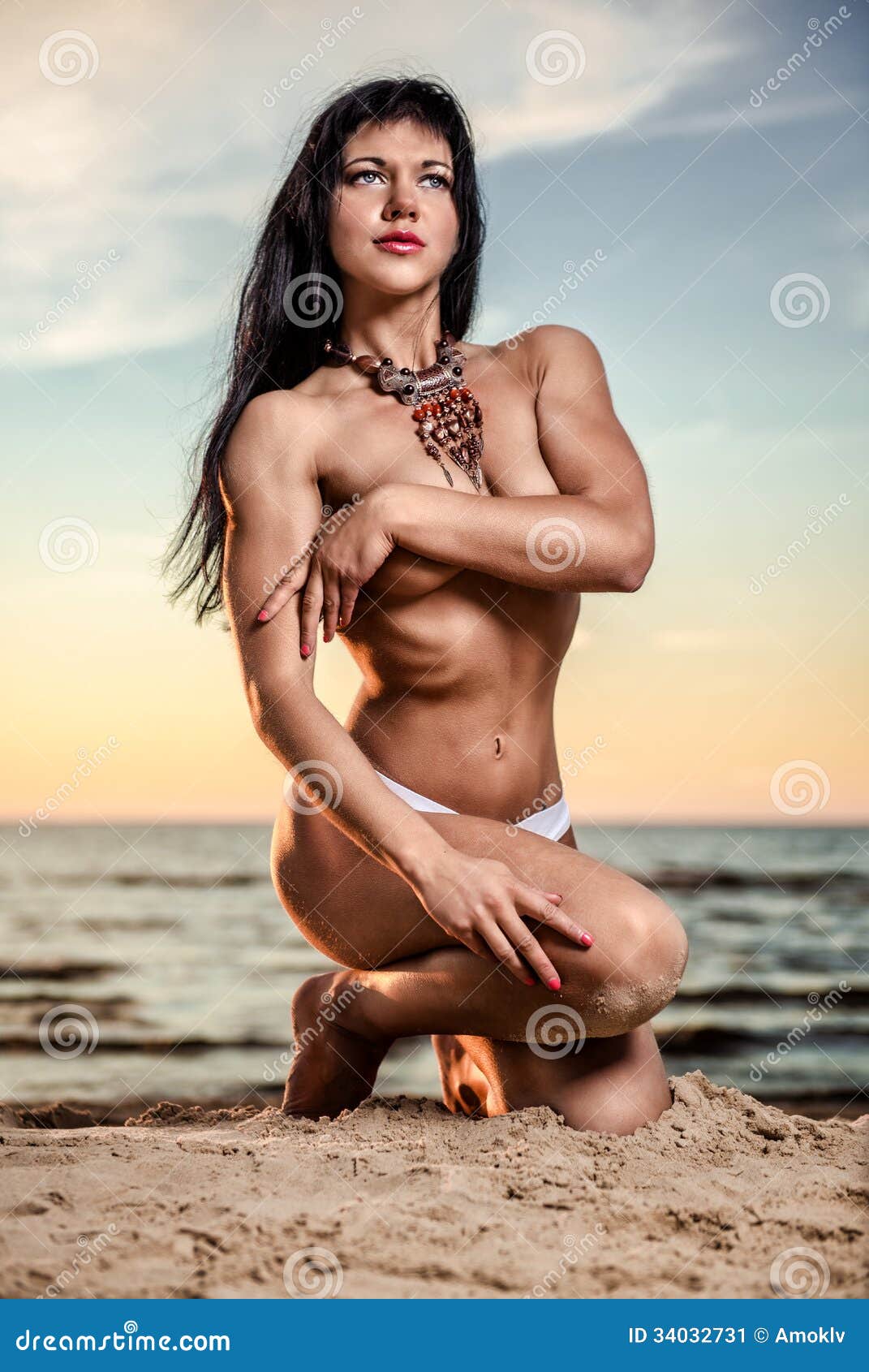 Woman posing on the beach stock image photo