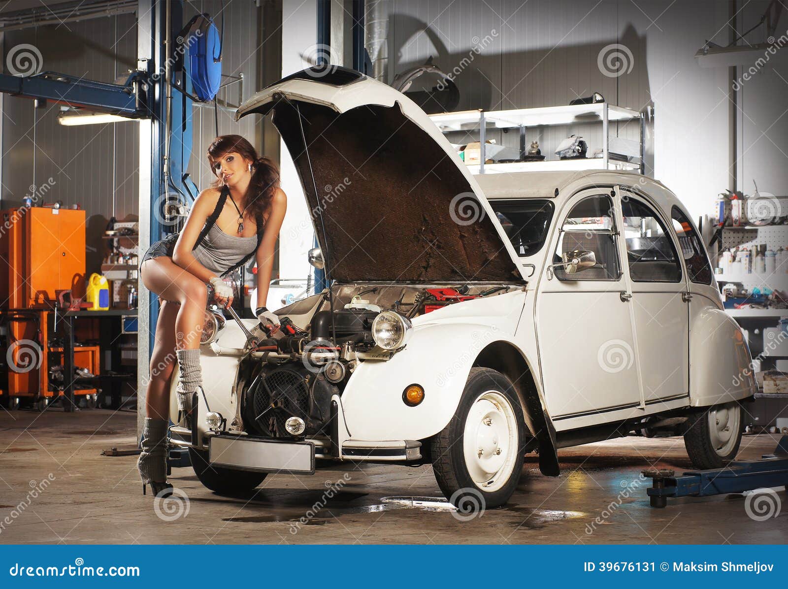 A Woman Repairing A Retro Car In A Garage Stock Image Image 39676