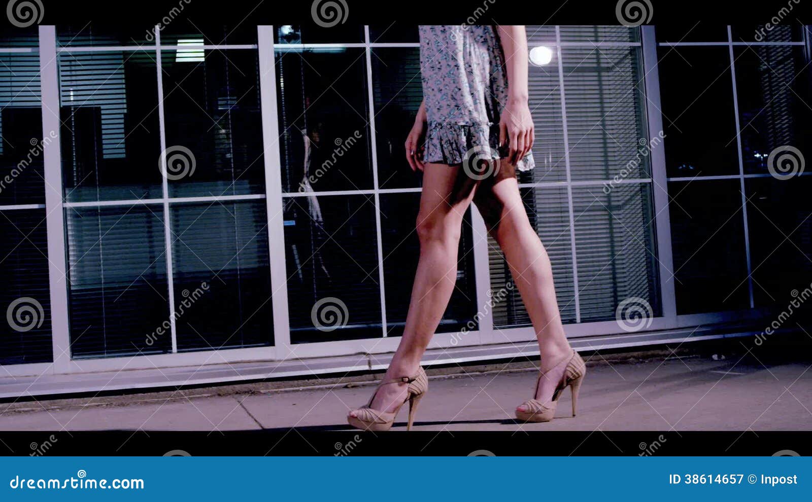 Ladylike candid with nice legs walking in the street