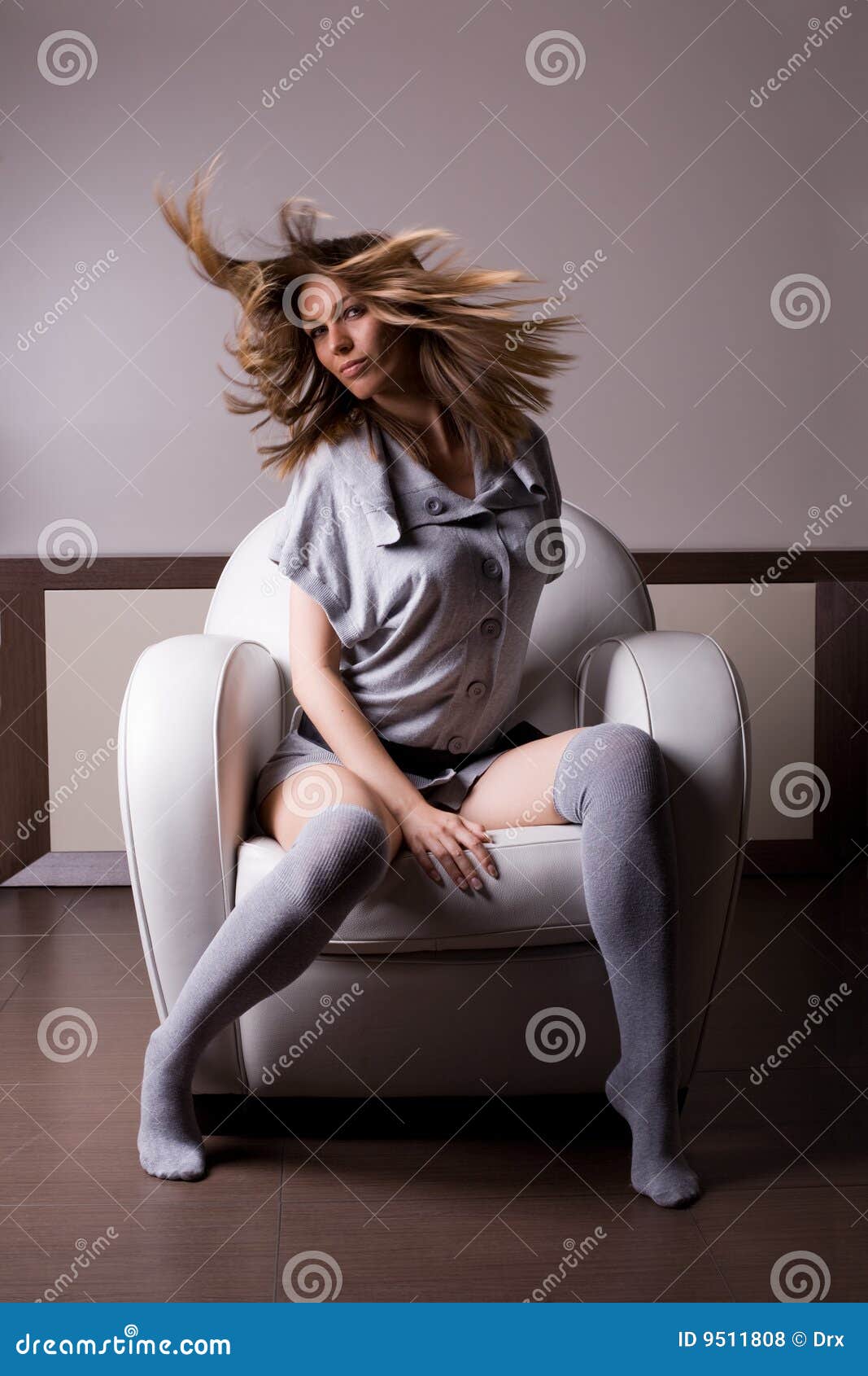 woman in sofa. woman in white sofa with beautiful hair