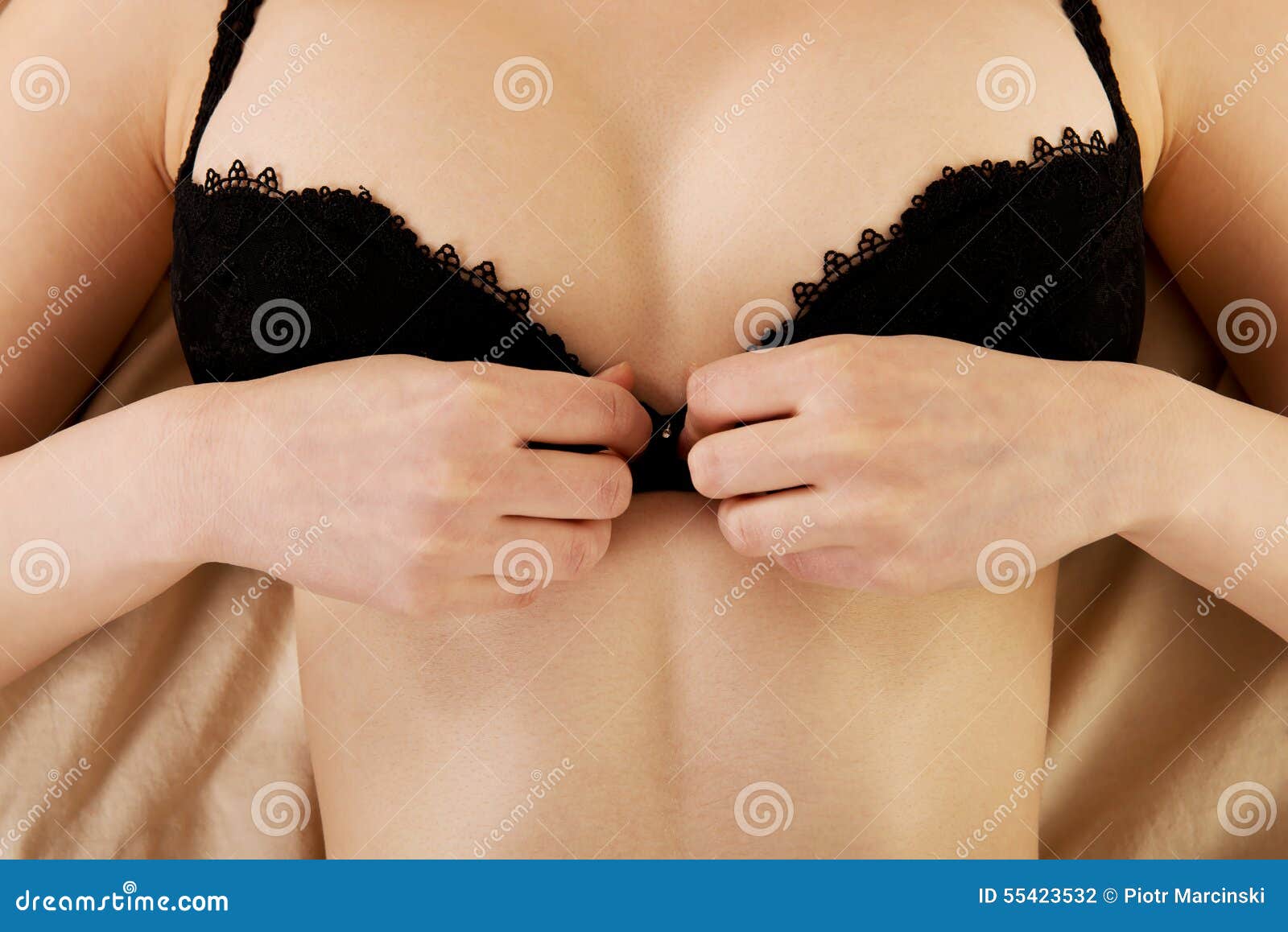 Taking off her bra