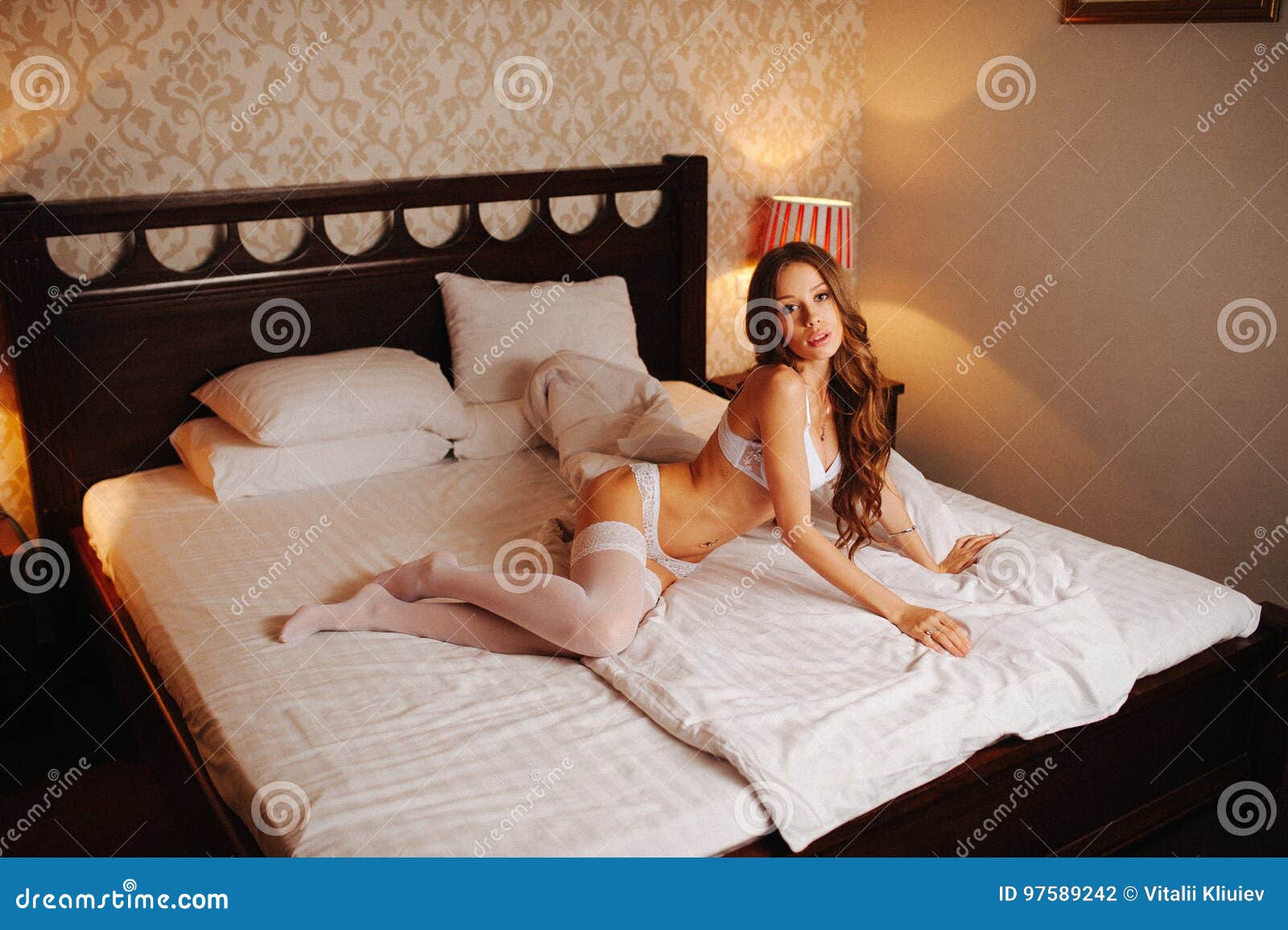 Beautiful Slim Girl With Big Sexy Breasts Poses On A Bed In A Hotel Stock  Photo, Picture and Royalty Free Image. Image 113384272.