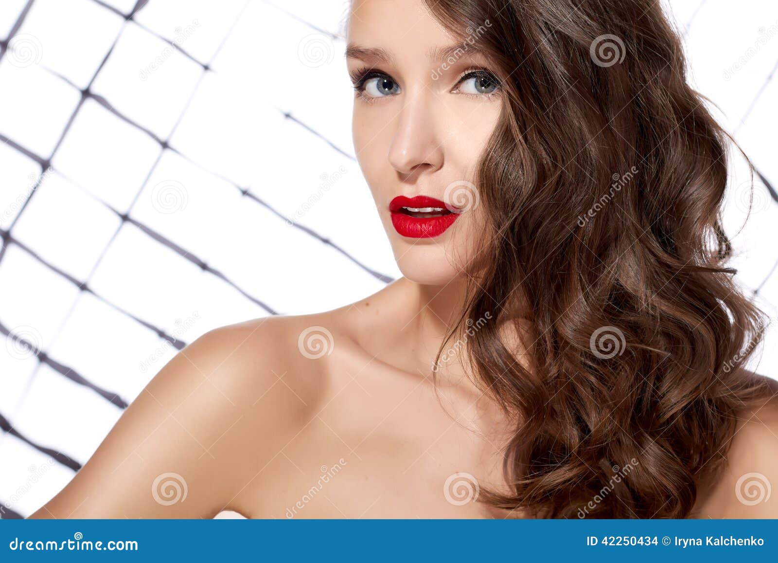 Young Beautiful Girl With Dark Curly Hair With Red Lips And