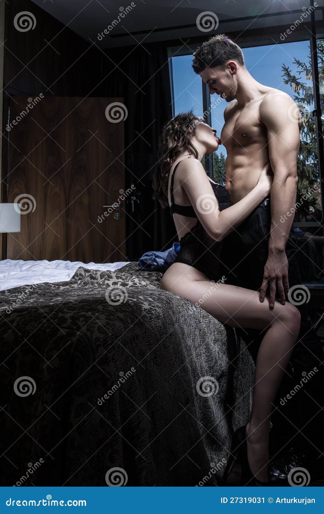 Young couple in bedroom stock image. Image of caucasian - 27319031