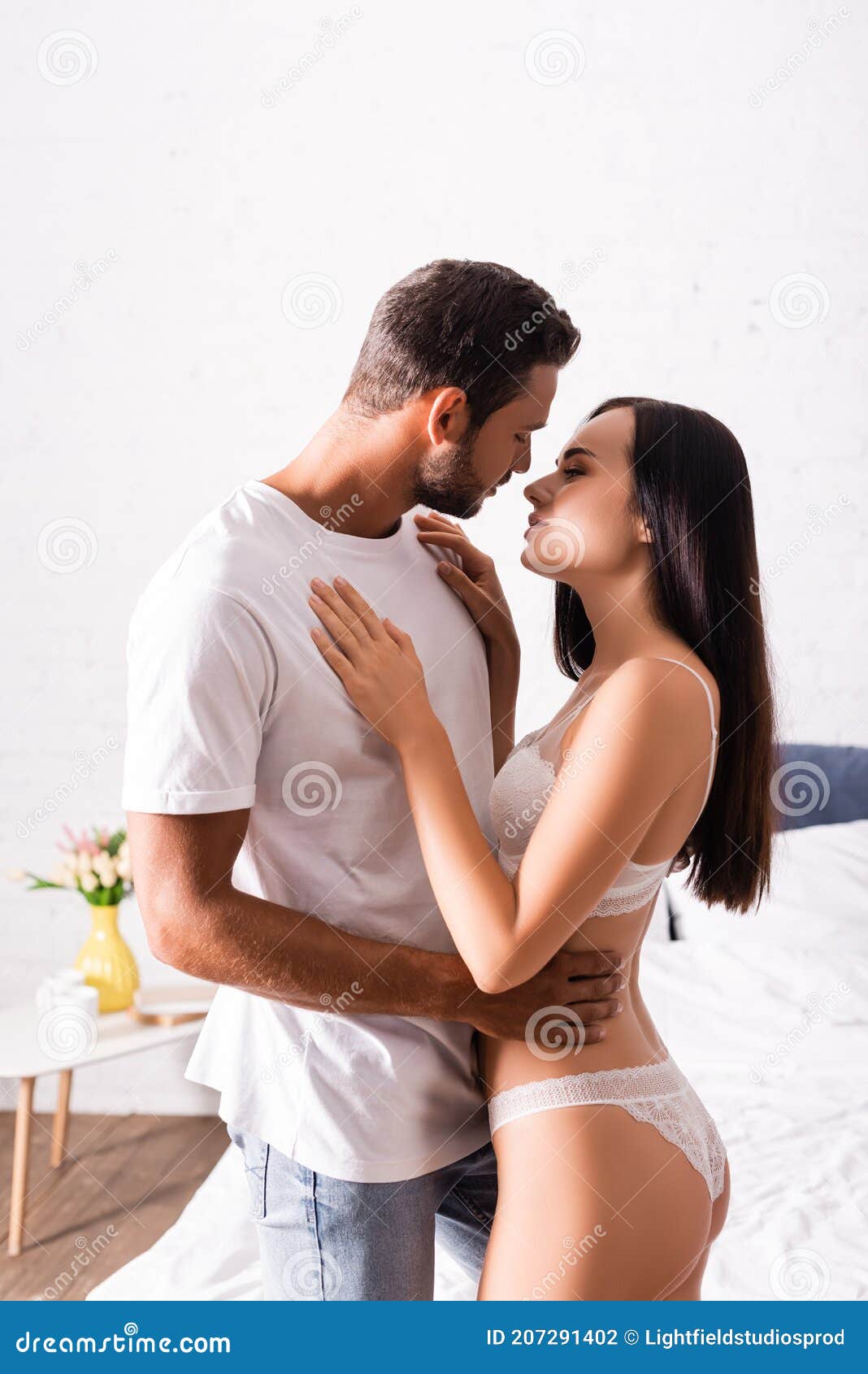 Sensual Young Brunette Woman with Man Stock Photo