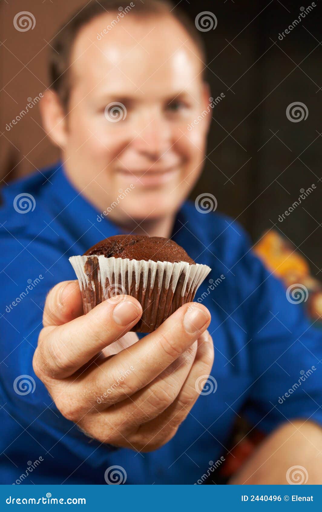 Young man with muffin stock photo. Image of adult, home 2440496