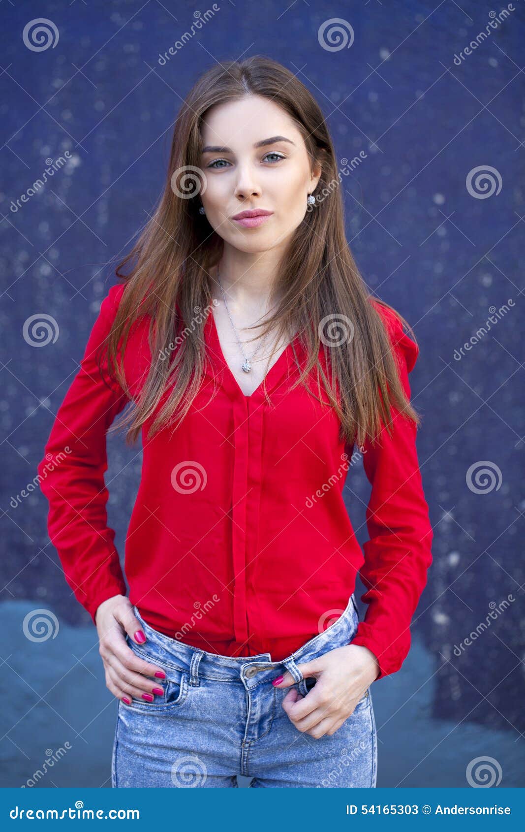 Young Woman, Against the Background of the Dark Blue Wall Stock Image