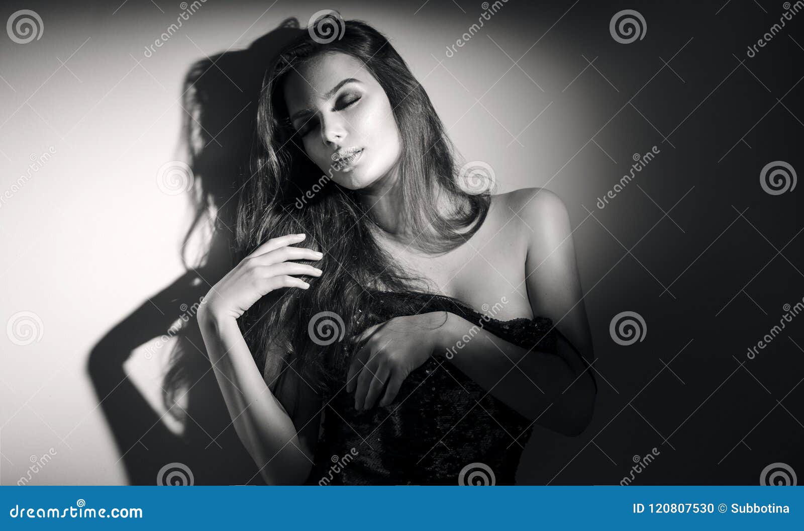 young woman black and white portrait. seductive young woman with long hair