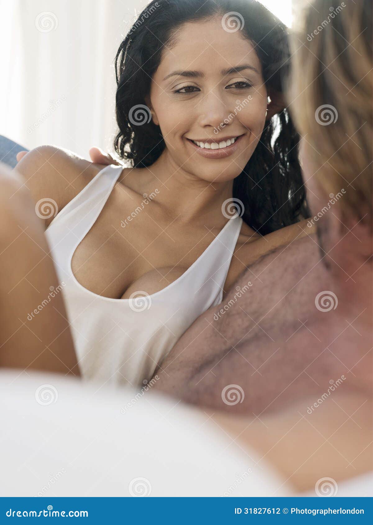 Young Woman With Man In Bed. young women with men spending quality time together in bed