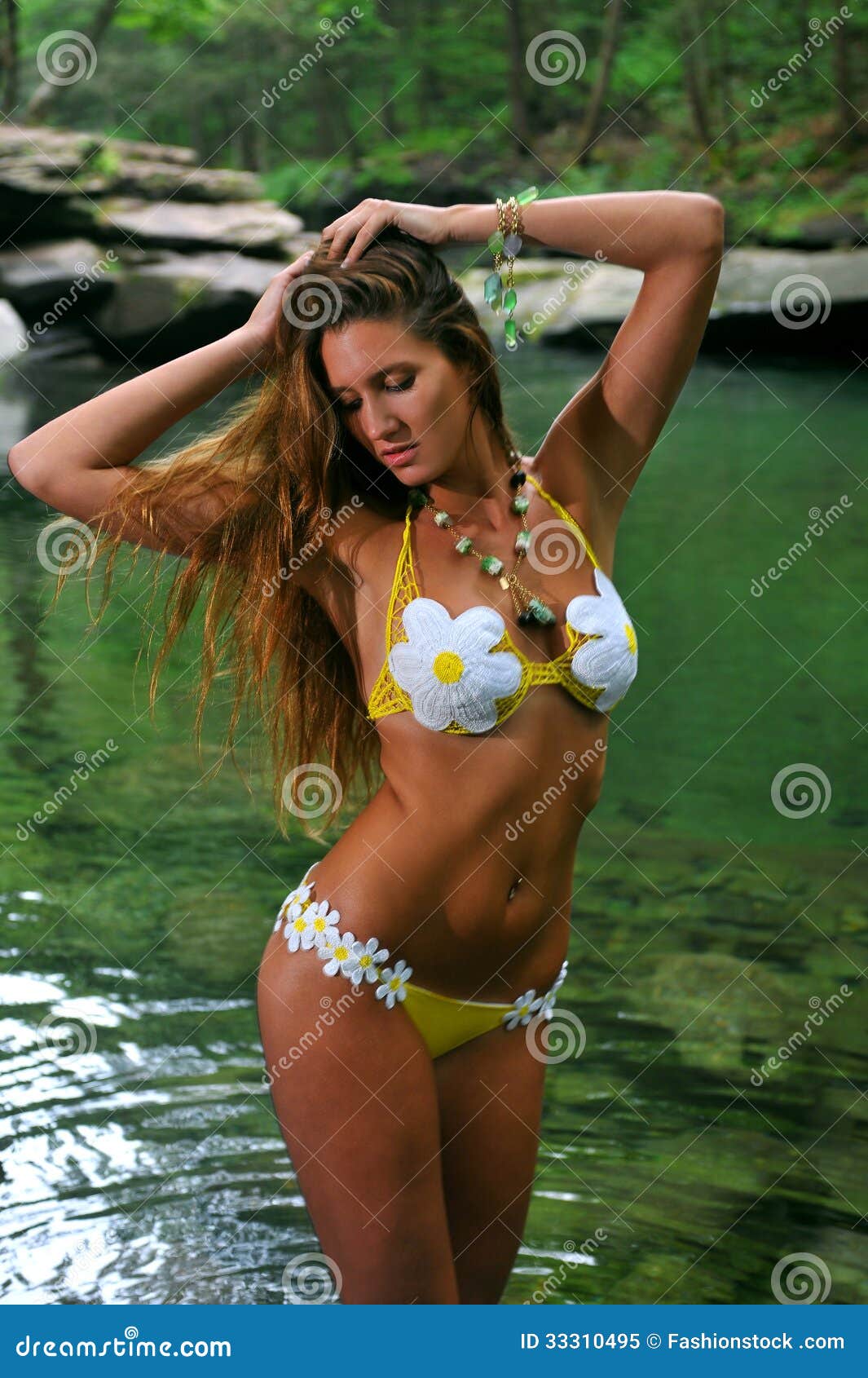 Young Woman Posing in Designer Bikini at Exotic Location of Mountain River Stock Image