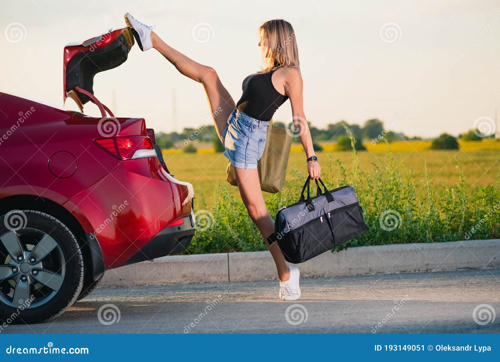 Sexy girl pushing car