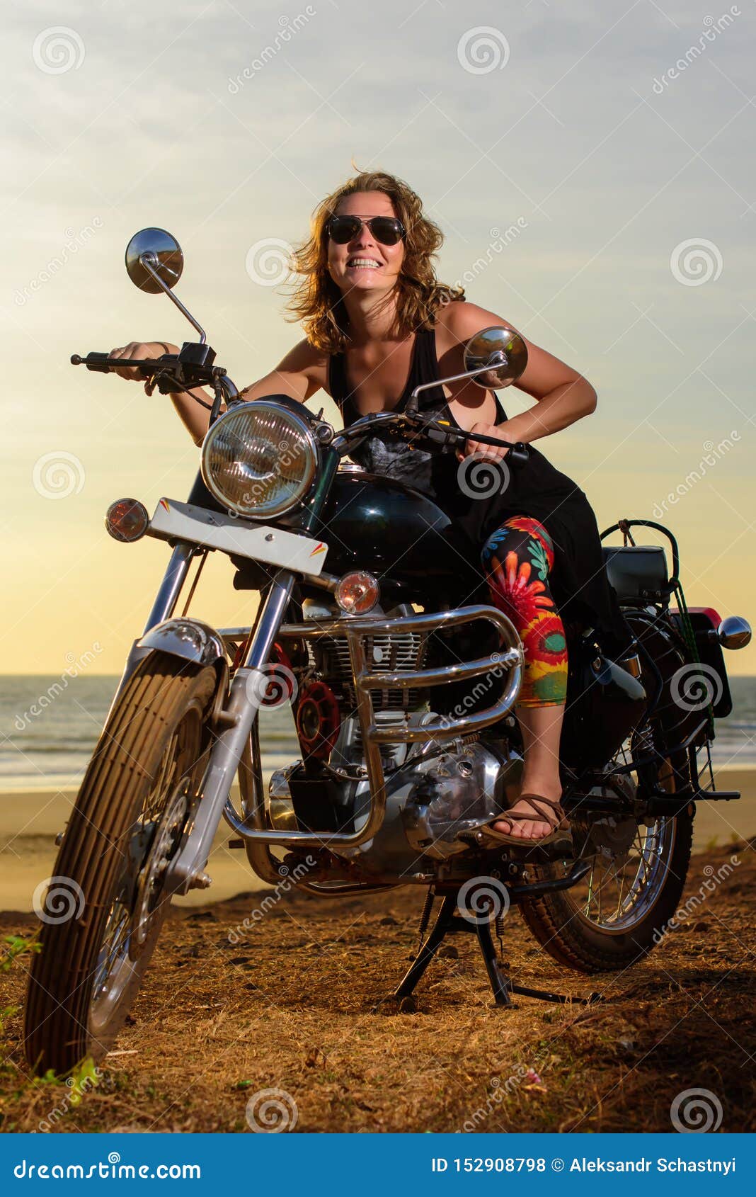 A Young Woman in Sunglasses Sits on a Black Chrome Motorbike. Hipster Girl on a Motorcycle Against the Sunset Stock Photo - Image of motorbike, bike: 152908798 A Young Woman in Sunglasses Sits on a Black Chrome Motorbike. Hipster Girl on a Motorcycle Against the Sunset Stock Photo - Image of motorbike, bike: 152908798
