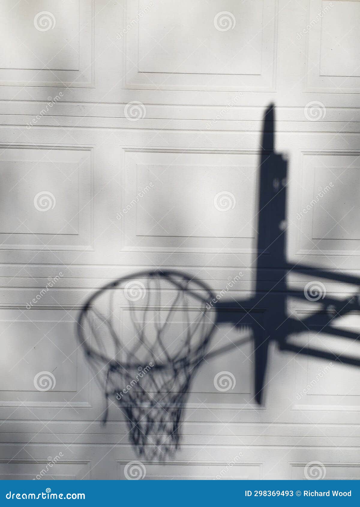 Shadow of a Basketball Goal on Garage Door Stock Image Image of