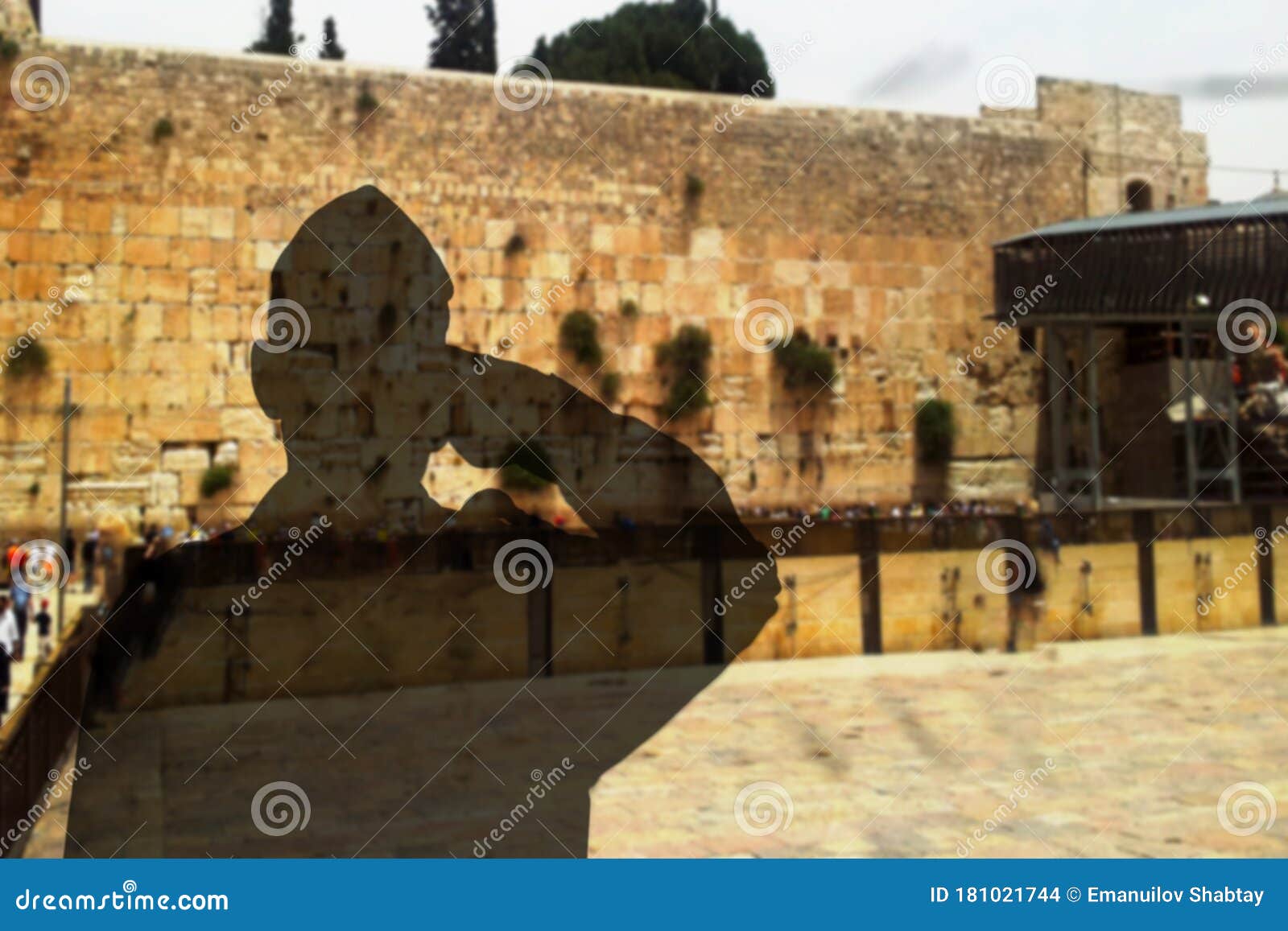 shadow silhouette of a israeli soldier israel defense forces, idf salutes on a western wall kotel in old city of jerusalem