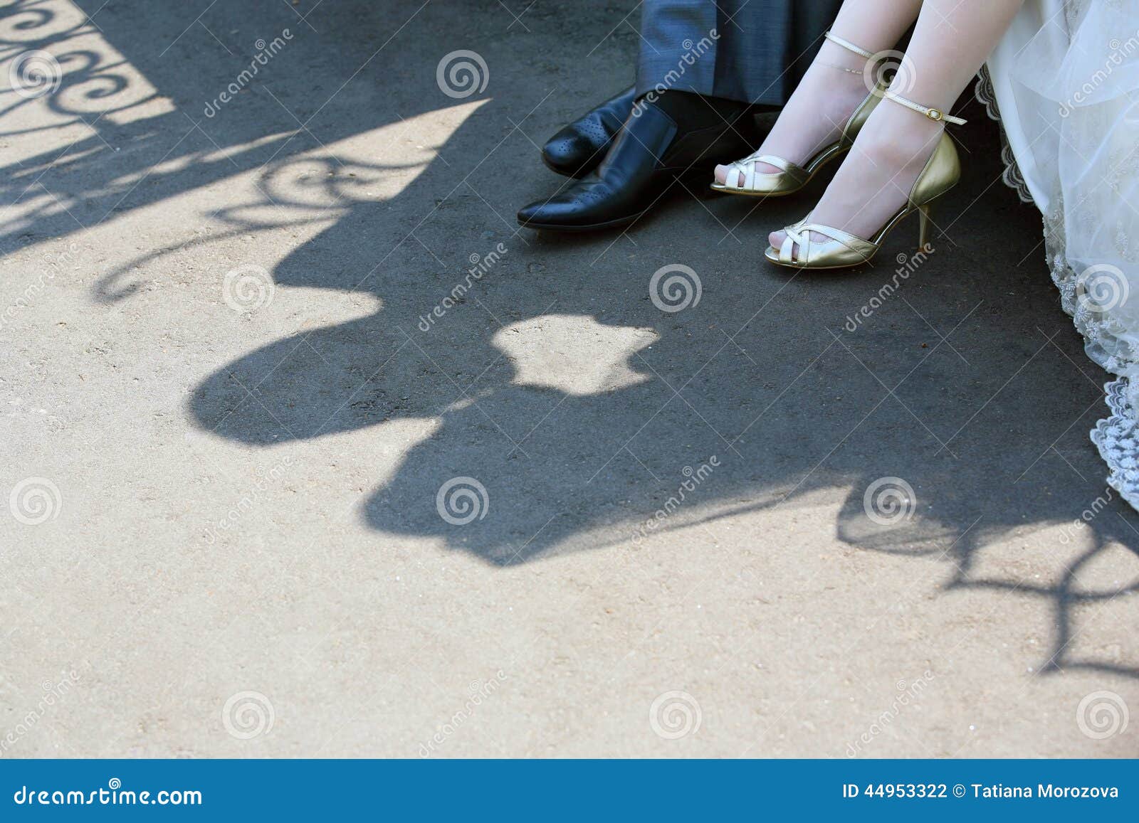 Shadows. Shadow of the groom and the bride on asphalt