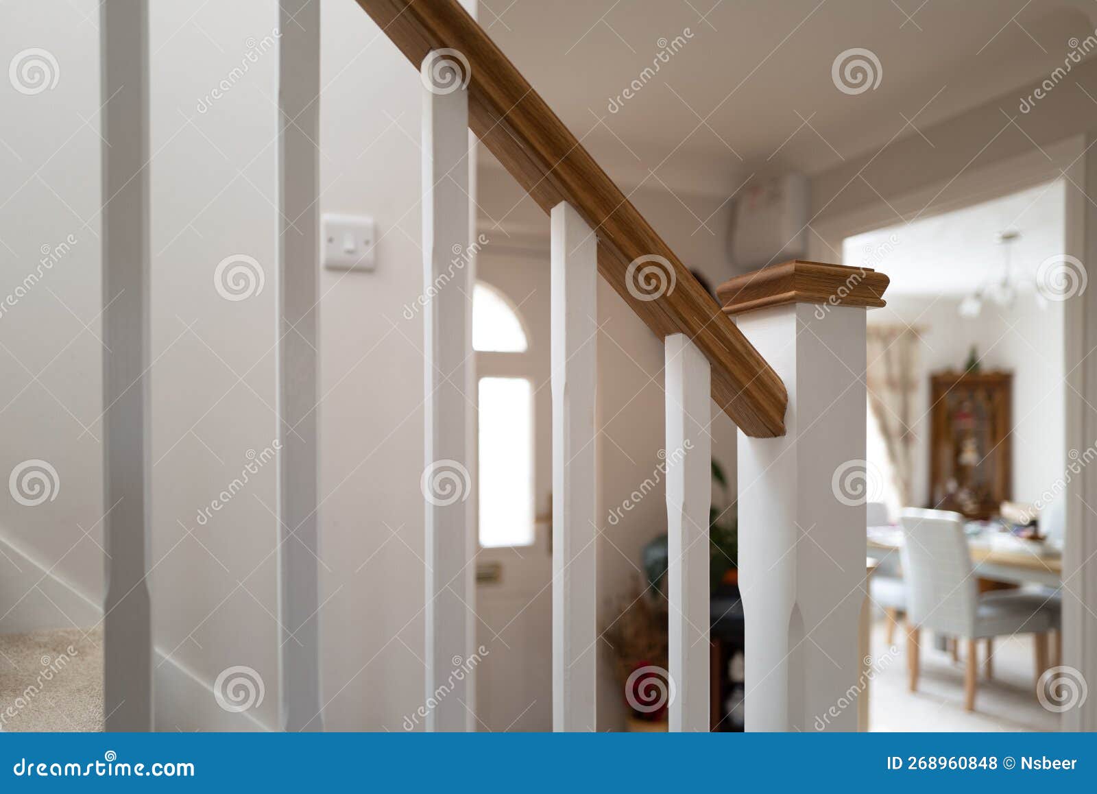 shallow focus of newly installed wooden bannisters leading to the first floor.