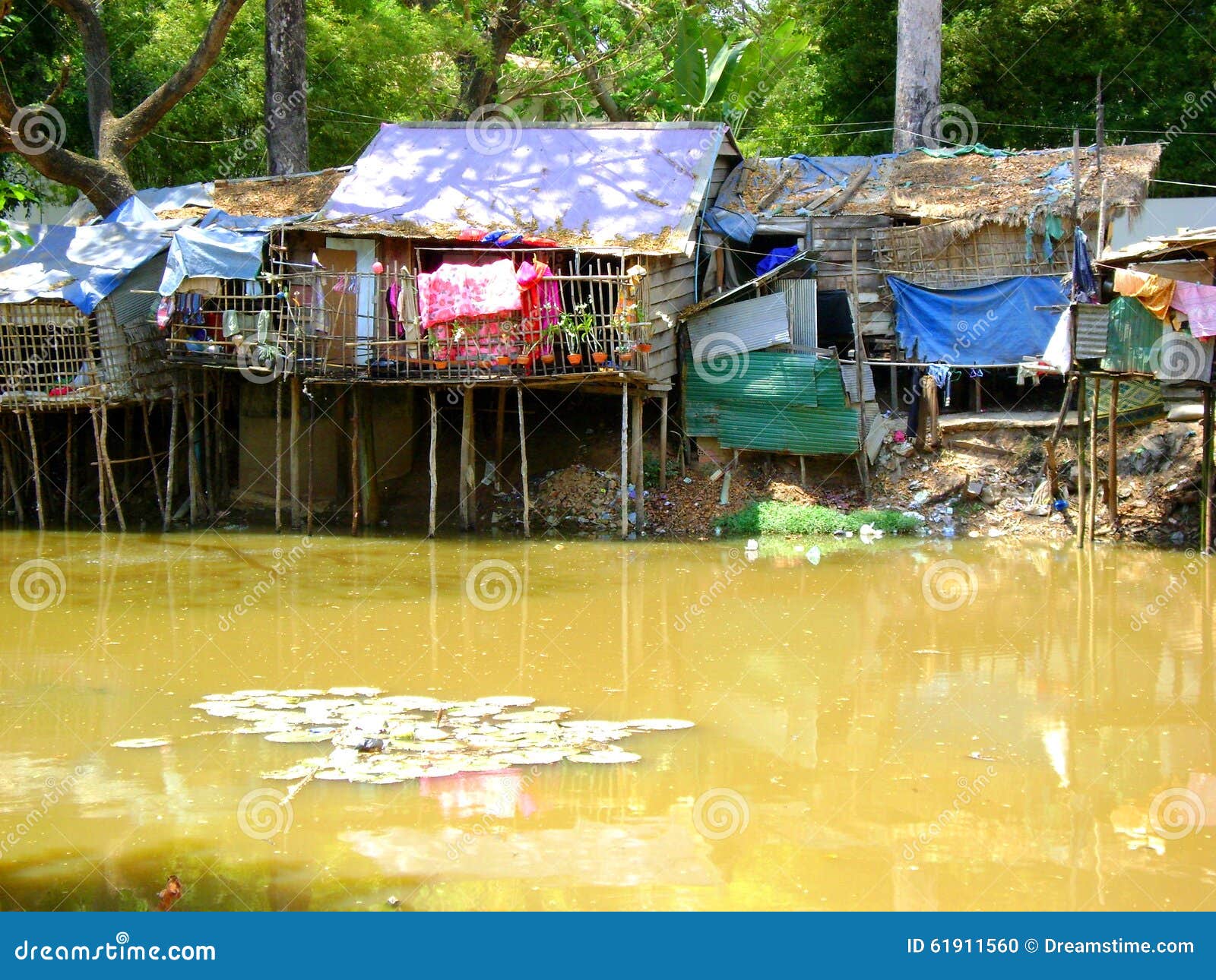 Shanty huts along river editorial image. Image of rice 61911560