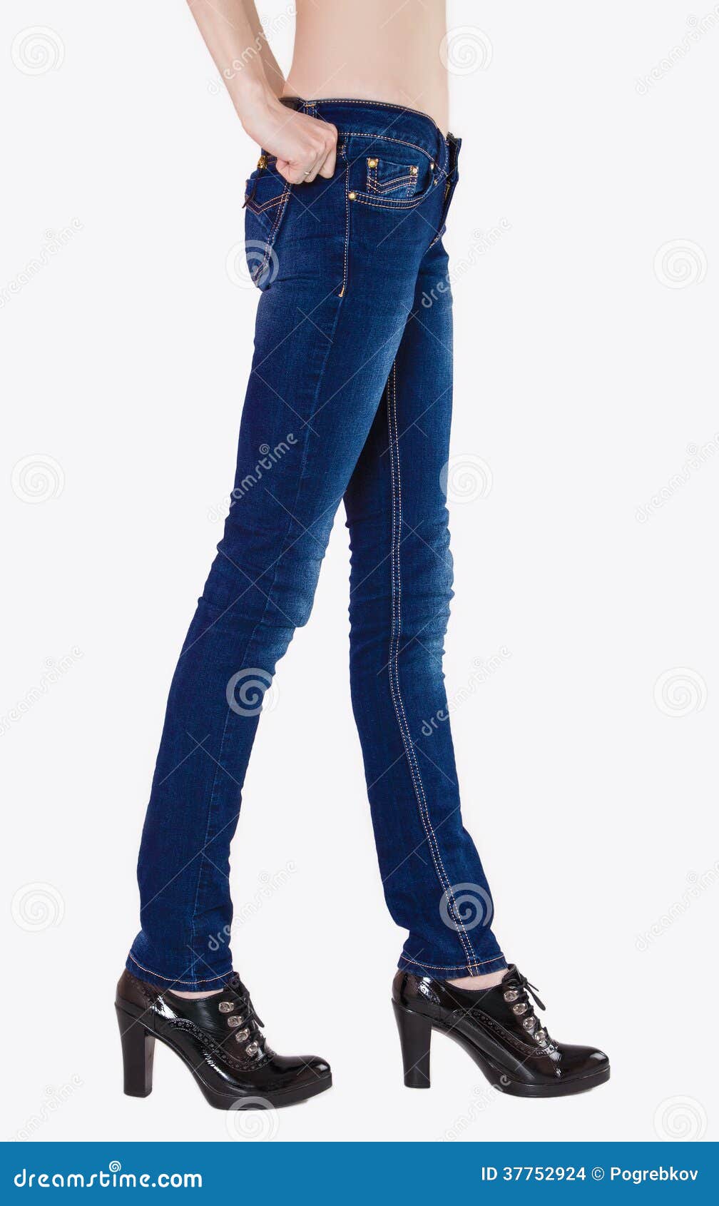 Shapely Female Legs Dressed in Dark Blue Jeans Stock Photo - Image of ...