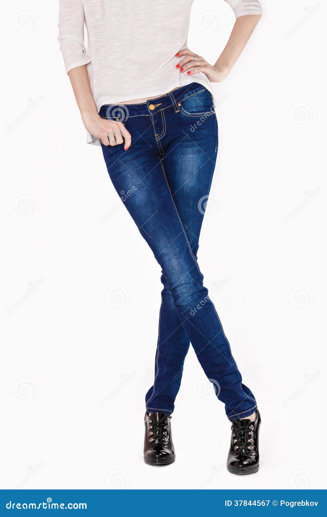 Shapely Female Legs Dressed in Dark Blue Jeans Stock Image - Image of ...