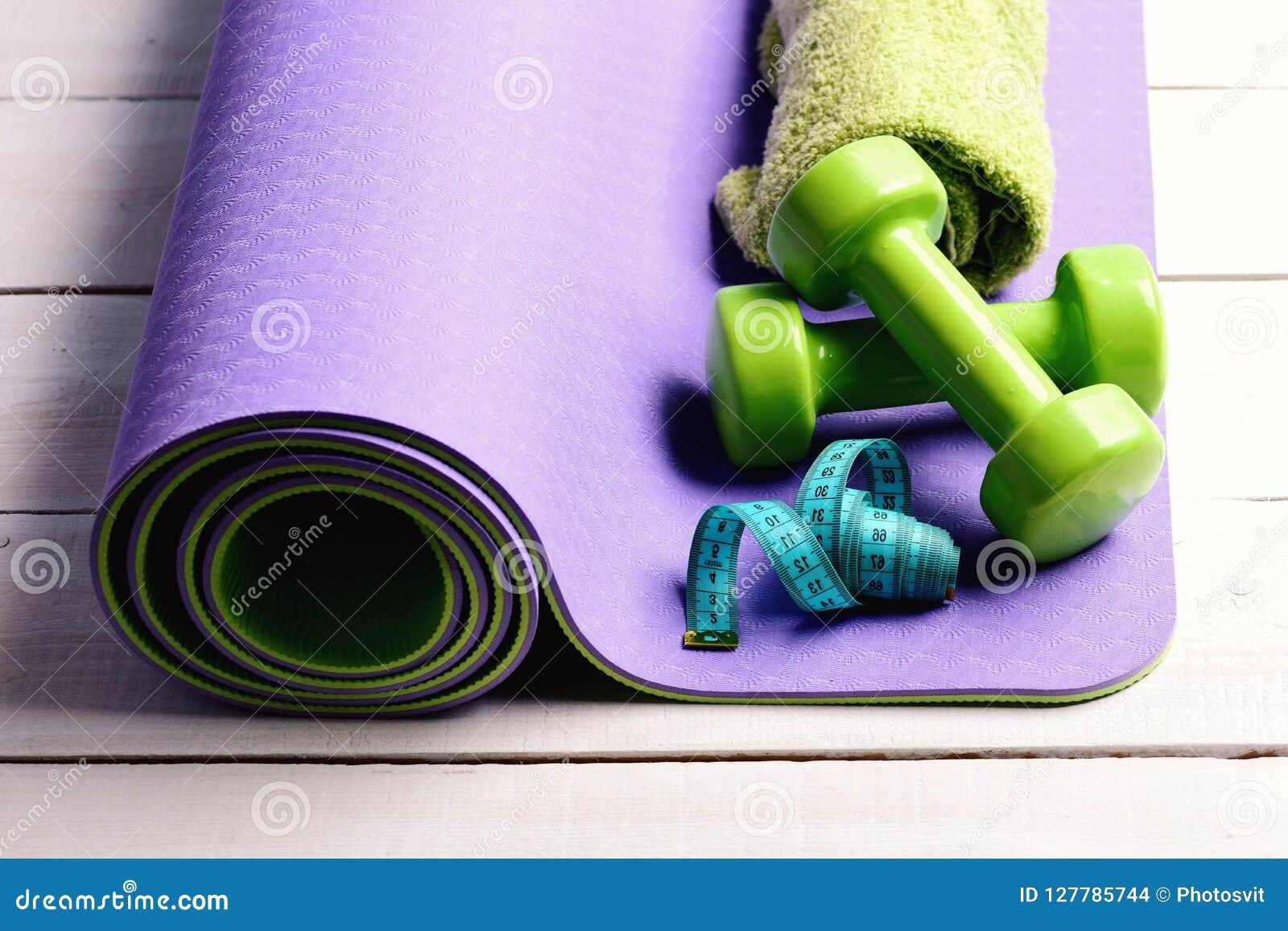 Shaping and Fitness Equipment. Barbells Near Cyan Measuring Tape Roll ...