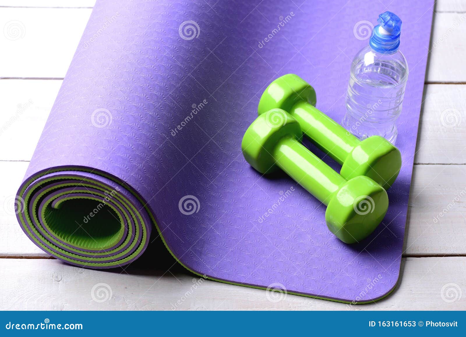 Shaping And Fitness Equipment. Dumbbells Made Of Green Plastic Stock ...