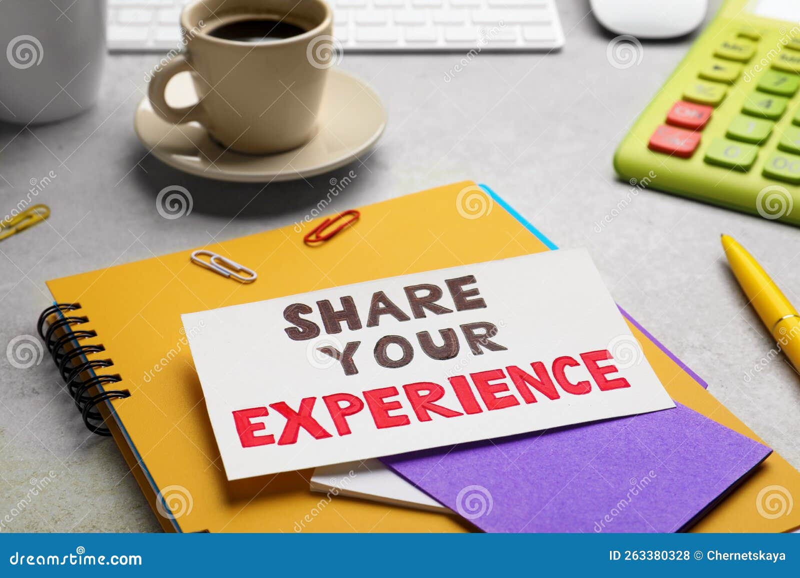 Share Your Experience. Workplace with Card and Stationery on Light