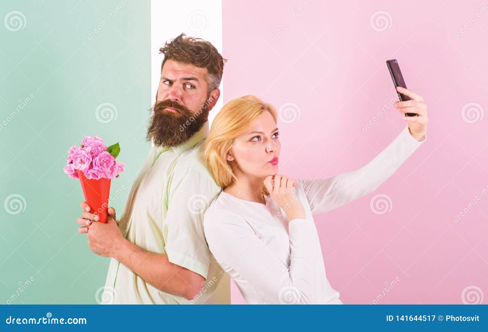 sharing happy selfie. woman capturing happy moment boyfriend bring bouquet flowers. capturing moment to memorize. taking