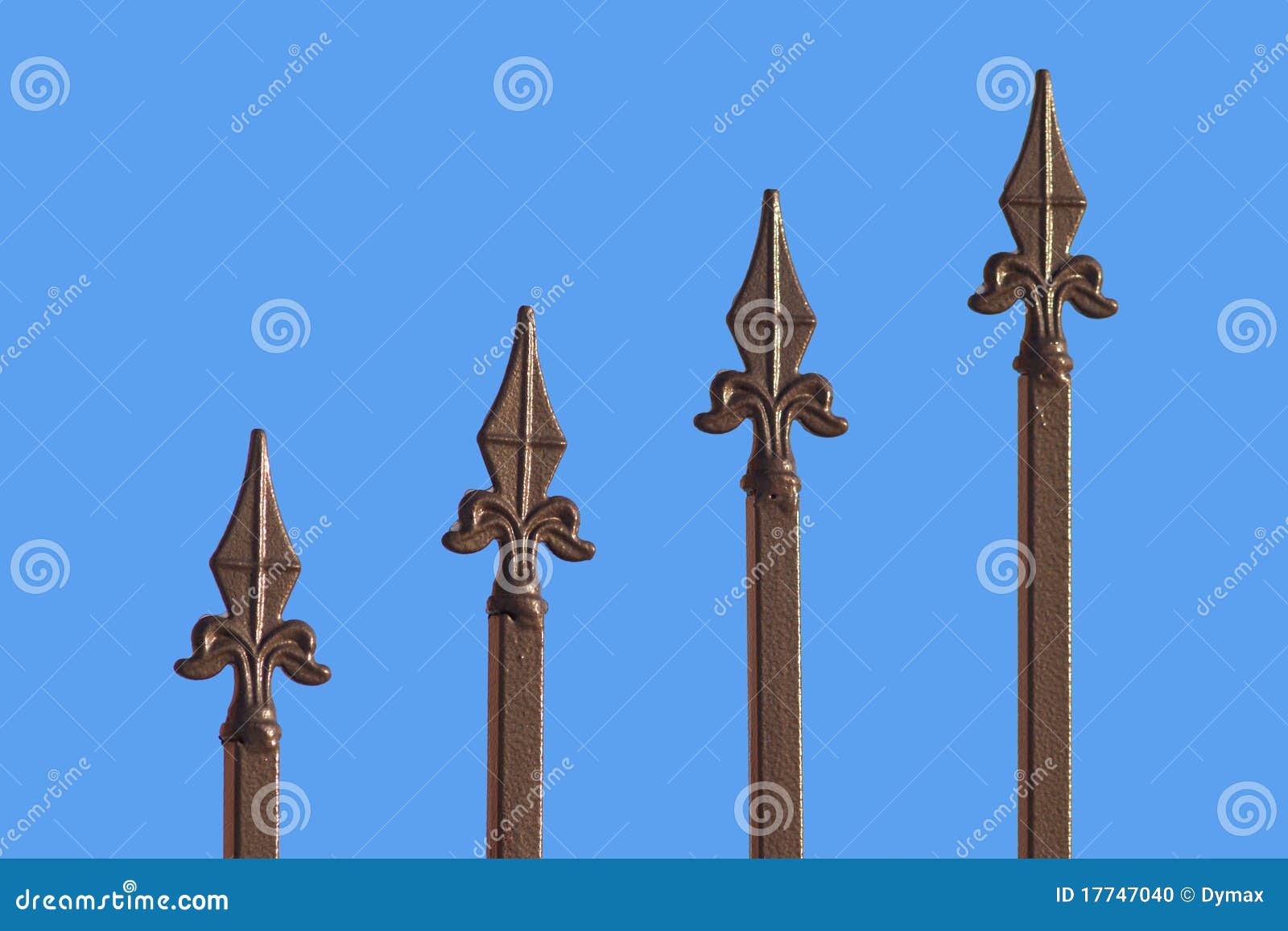 Sharp bronze fence isolated on blue. Four Sharp bronze fence rail isolated on blue