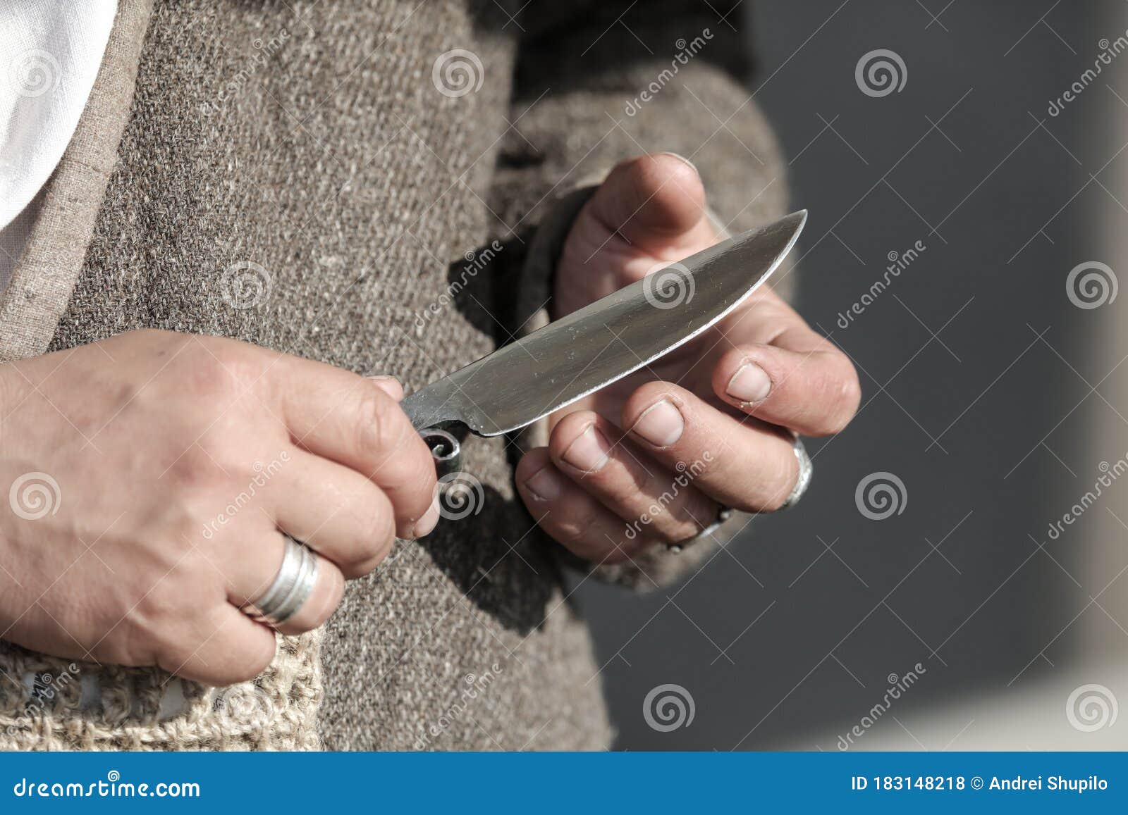 A sharp knife in the hands stock photo. Image of violence 183148218