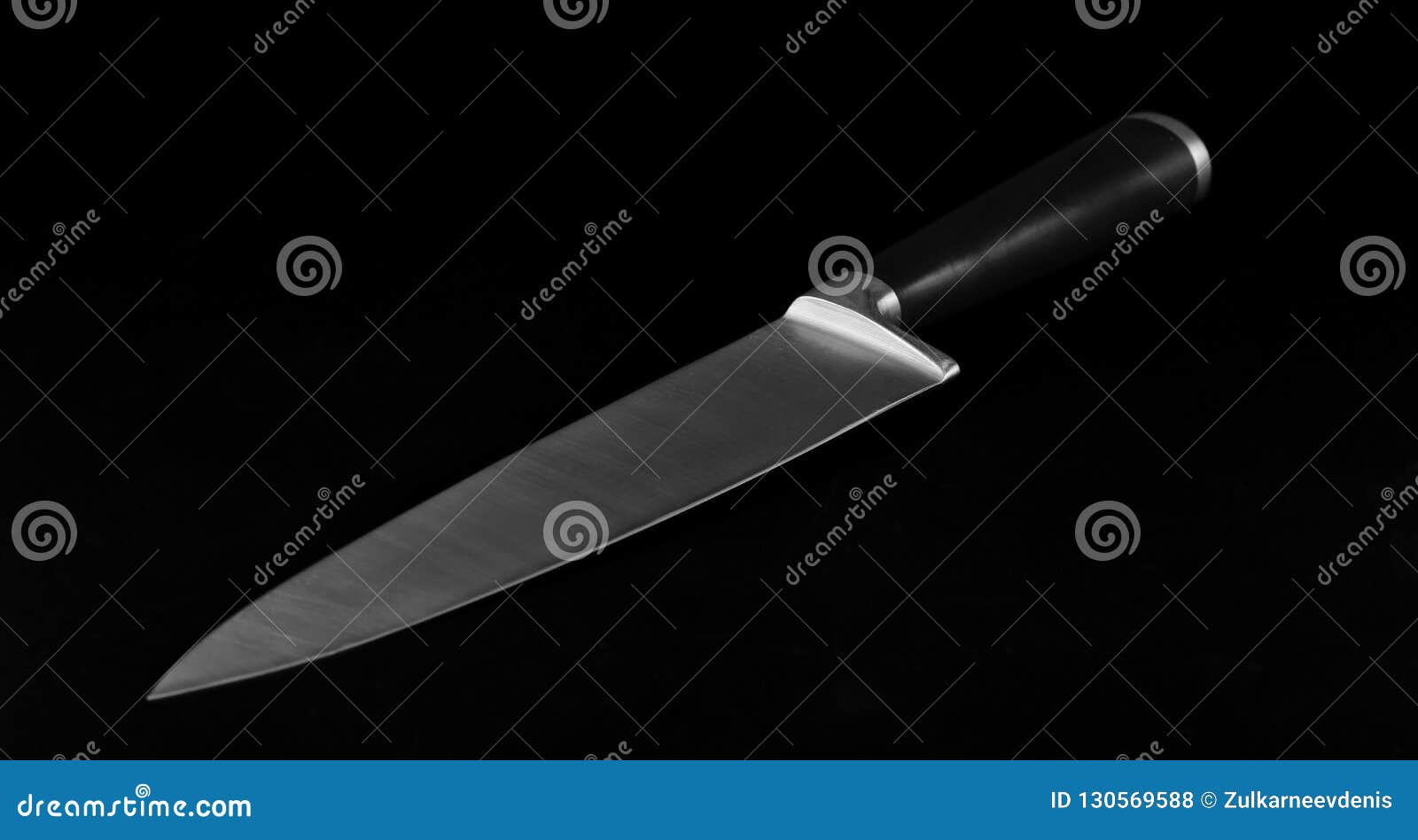 Sharp Large Kitchen Knife on a Dark Surface. Stock Photo Image of