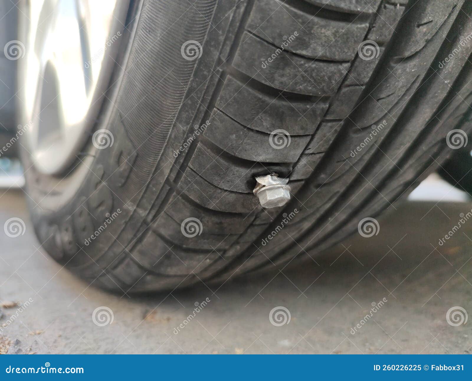 A Sharp is Embedded in a Car Tire. Stock Image Image of service