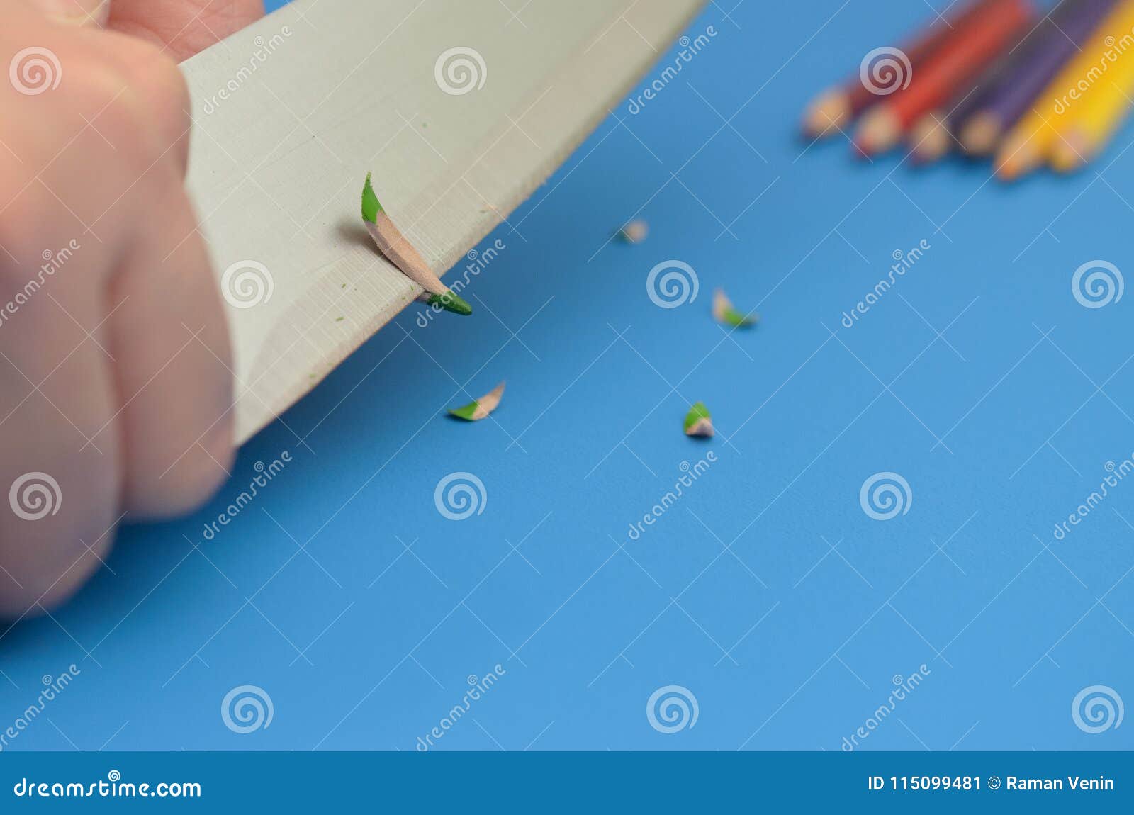 Sharpen the Colored Pencils with a Knife. Stock Image Image of