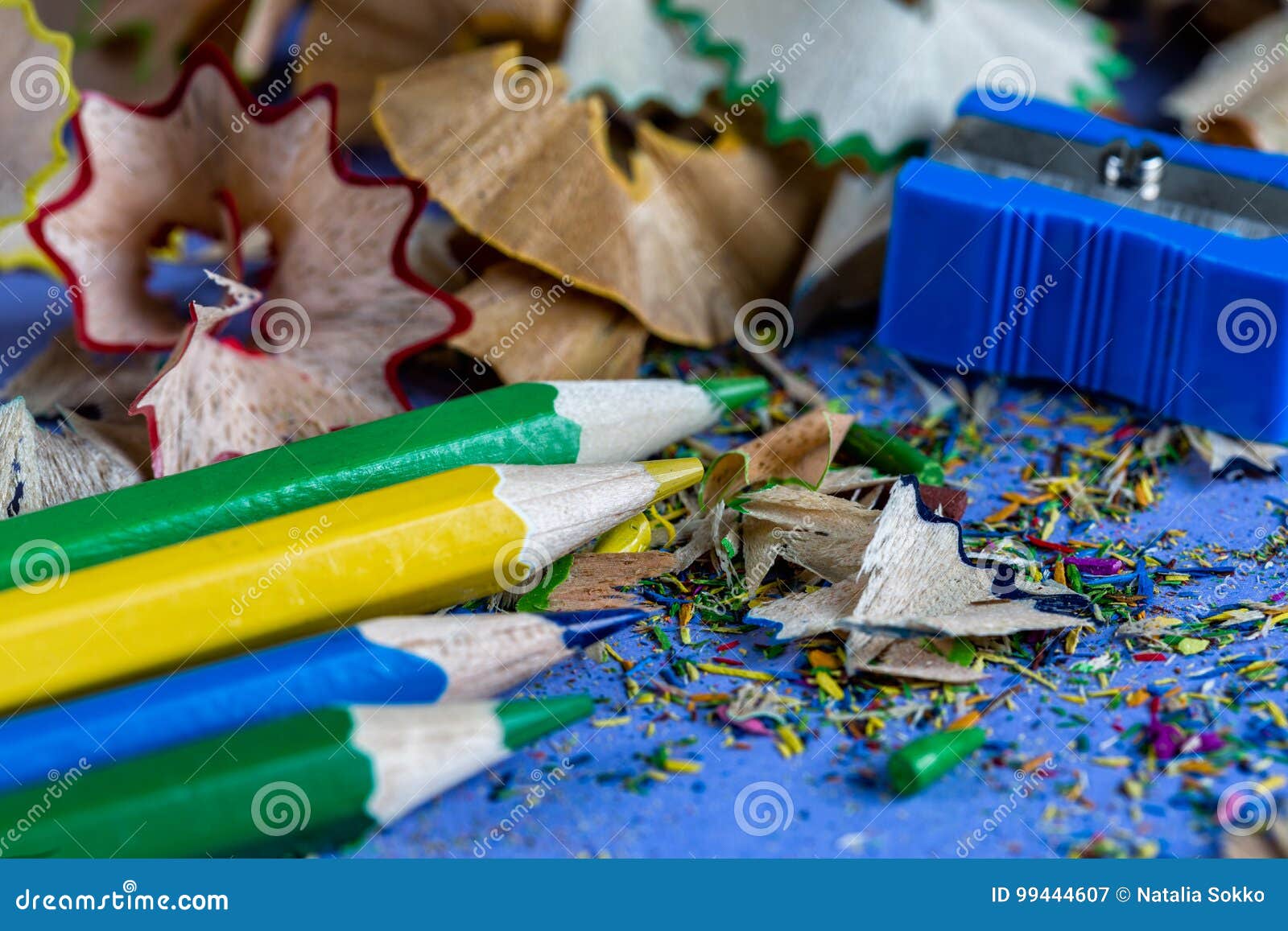 Sharpened Colored Pencils Sharpener and Pencil Shavings Stock Image