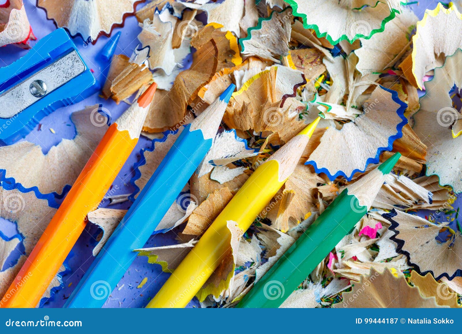 Sharpened Colored Pencils Sharpener and Pencil Shavings Stock Image