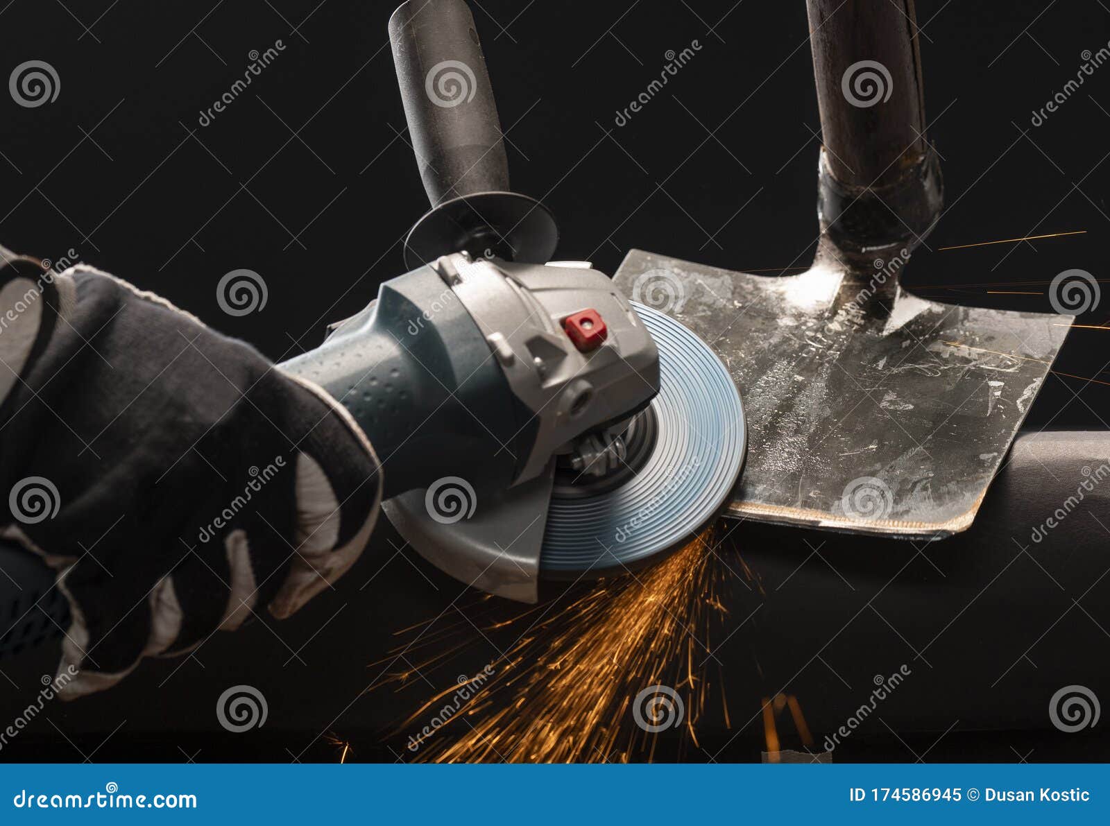 Sharpening Garden Shovel Blade with Electric Angle Grinder Stock Image