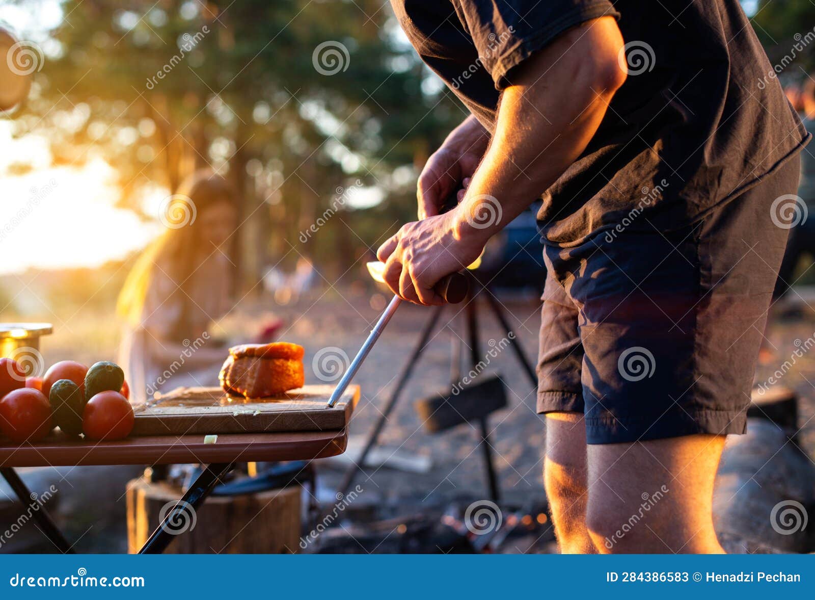 Sharpening a Knife in Nature at a Picnic for Cooking. Camping