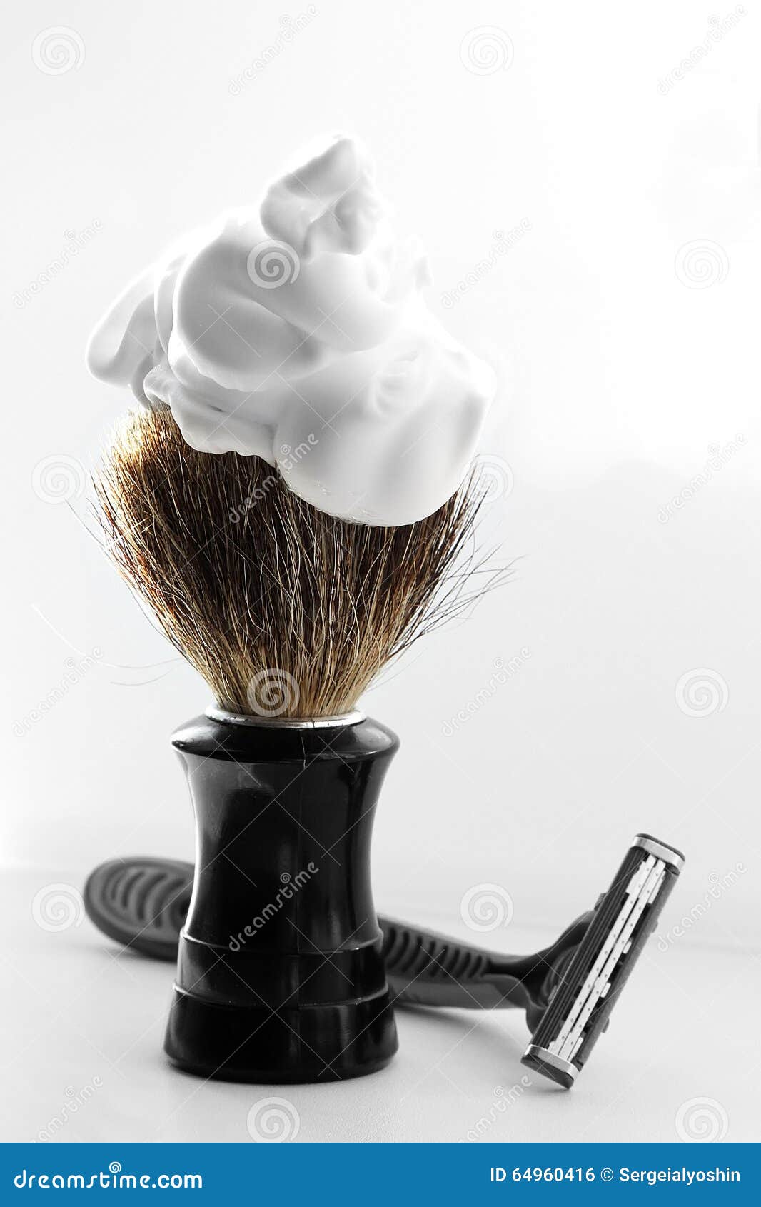shaving brush with foam on white background