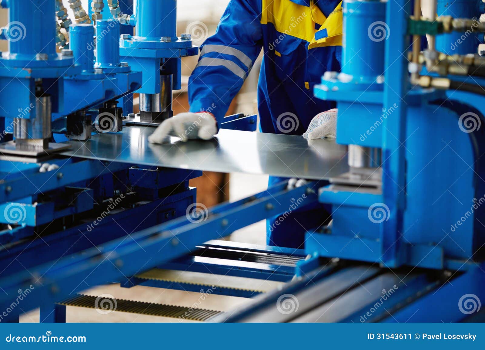 sheet of metal and hands of worker