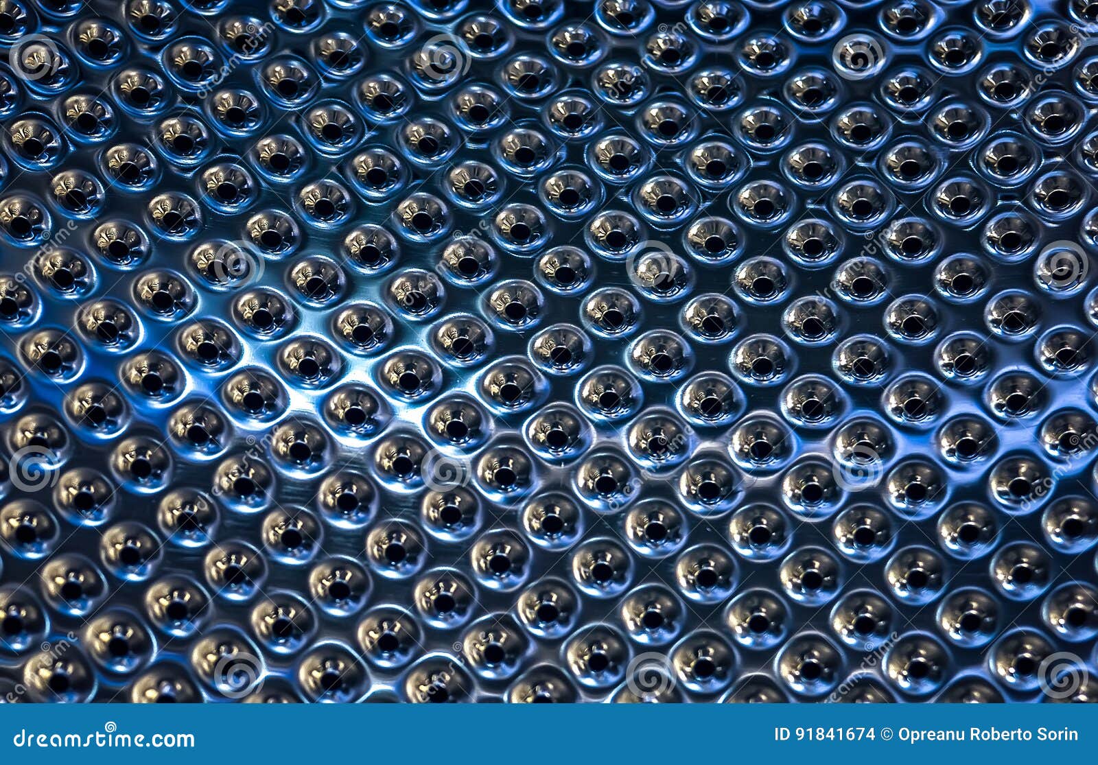 Sheet of Metal with Holes Punched Stock Photo Image of metallic