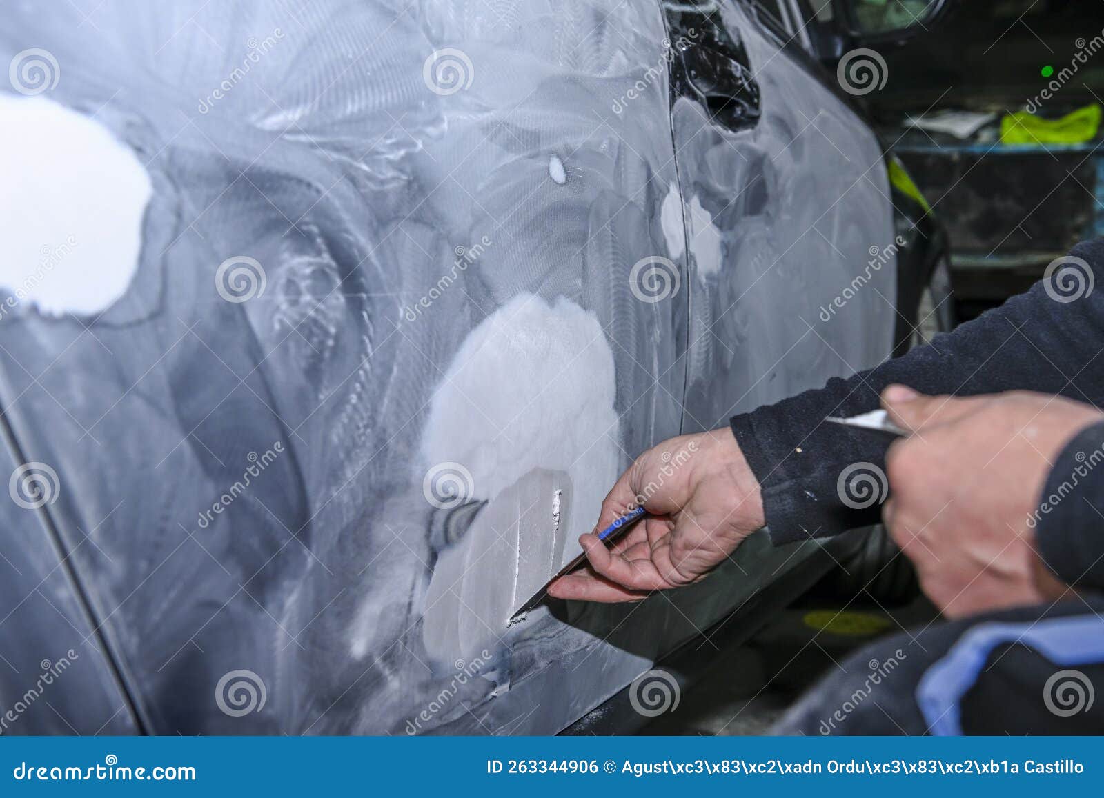 Sheet Metal Worker, Modeling with Putty, the Body of a Car. Stock Photo
