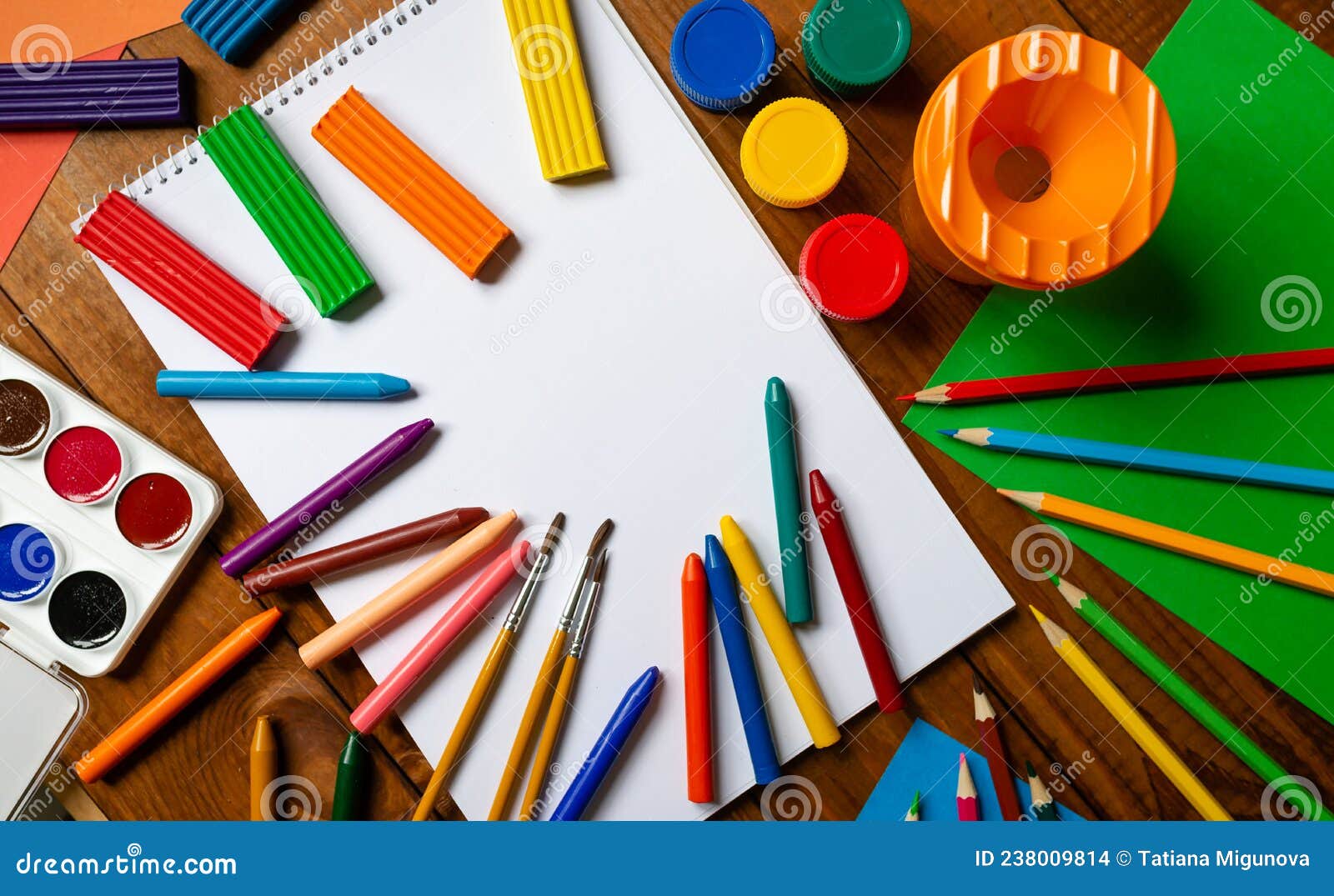 preschool art lesson background with copy space - colorful paper, pencils,  glue and scissors Stock Photo