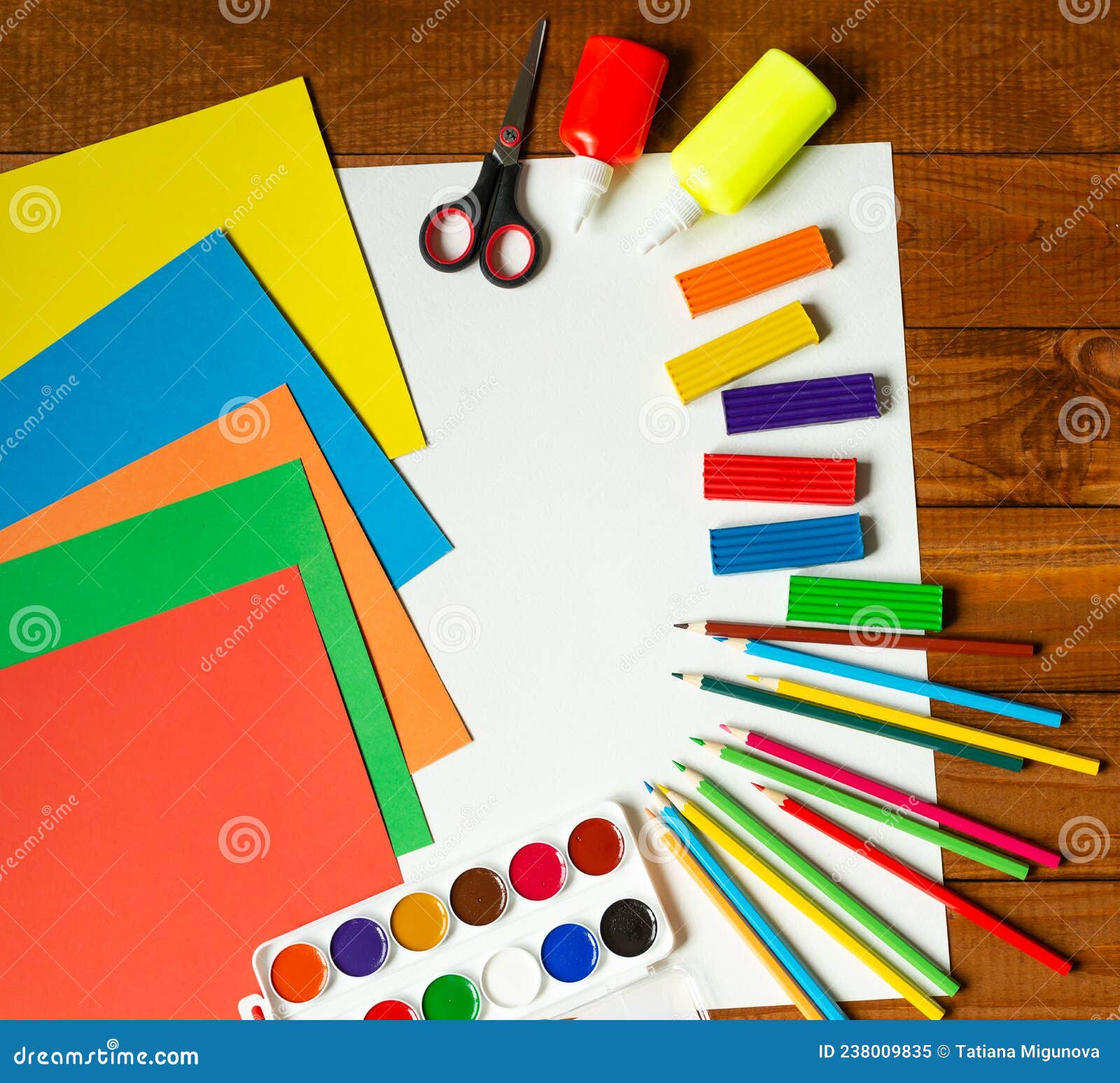 curly scissors and colored sheets of paper for scrapbook classes on a white  table. children's stationery creative tools. Creativity concept Stock Photo  - Alamy