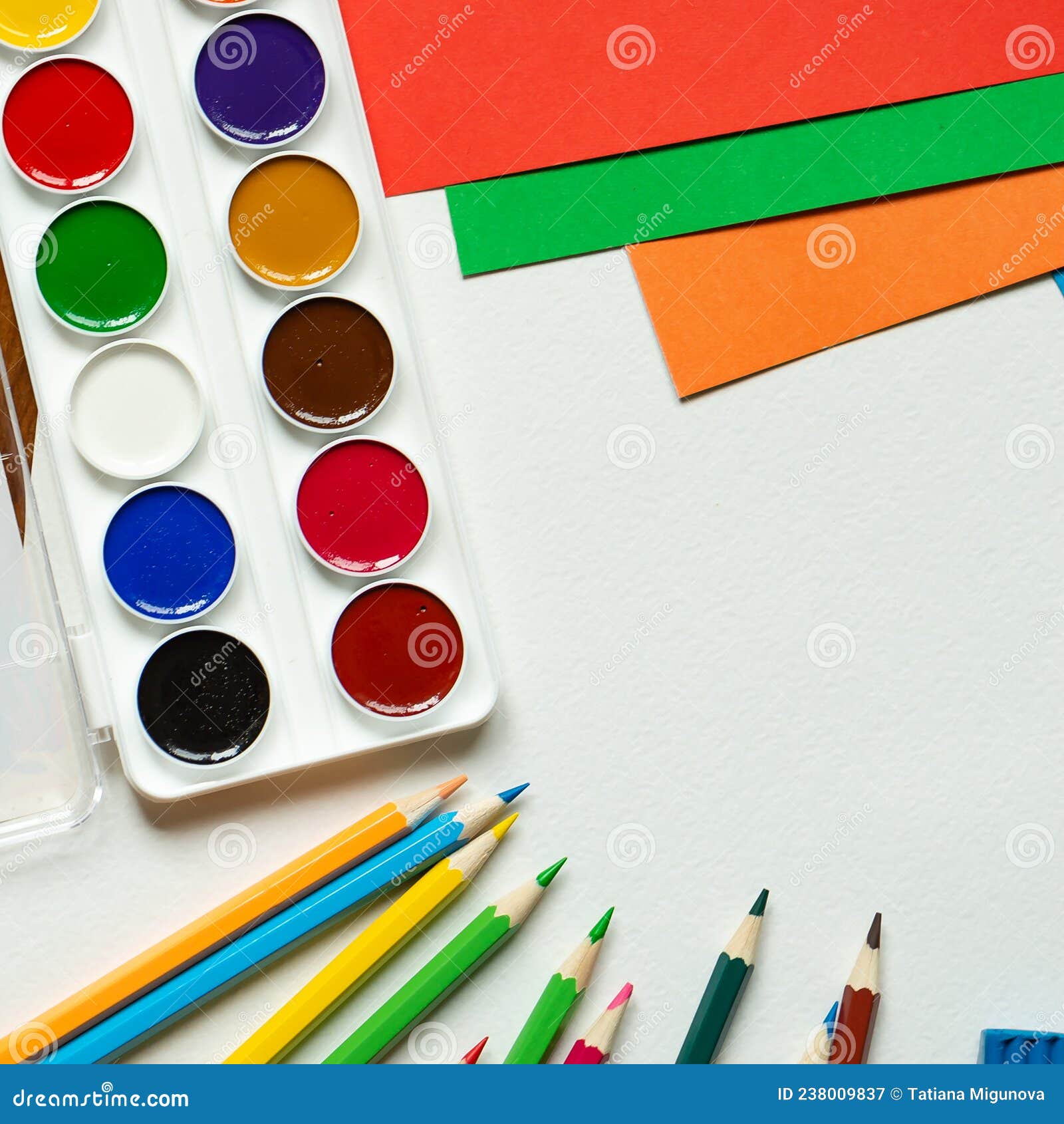 preschool art lesson background with copy space - colorful paper, pencils,  glue and scissors Stock Photo