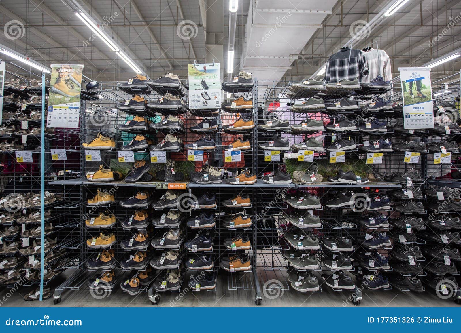 A Shelf of Hiking Shoes in a Supermarket Editorial Photo - Image of ...