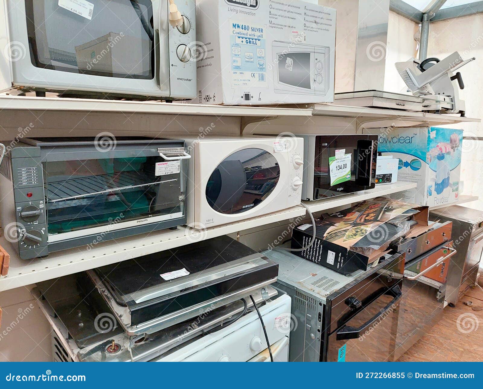 Shelf with Secondhand Appliances Inside a Store Editorial Image