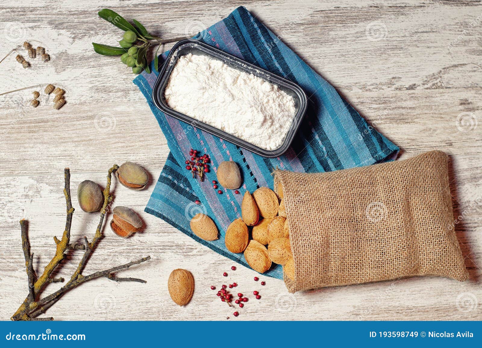 almonds in a cloth bag and container with flour iii