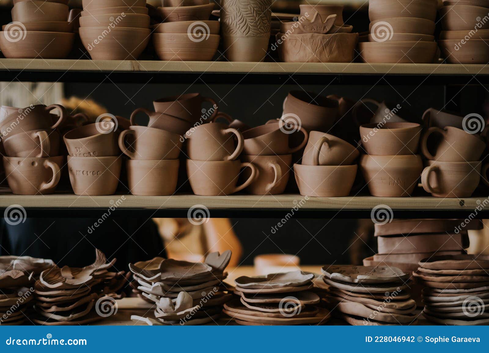 Shelves with Ceramic Dishware in Pottery Stock Photo Image