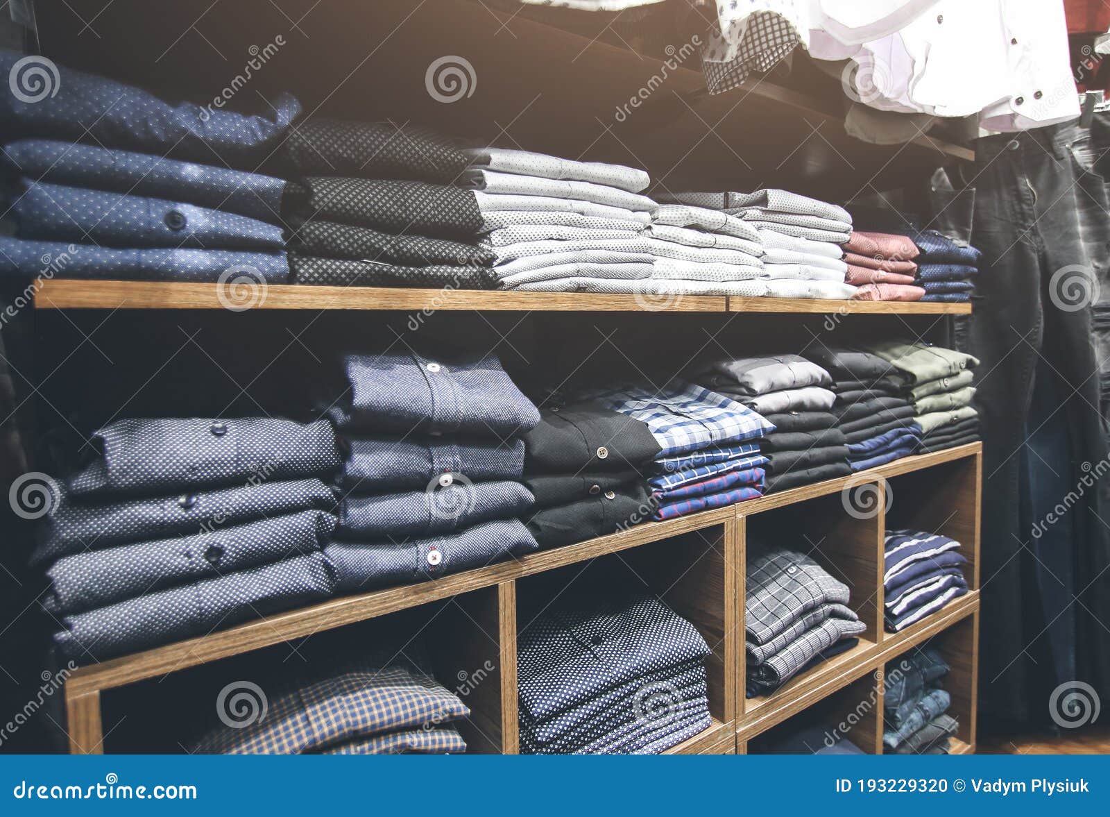 Shelves with Clothes in Shop. Bags, Suits, Trousers, Shirts and ...