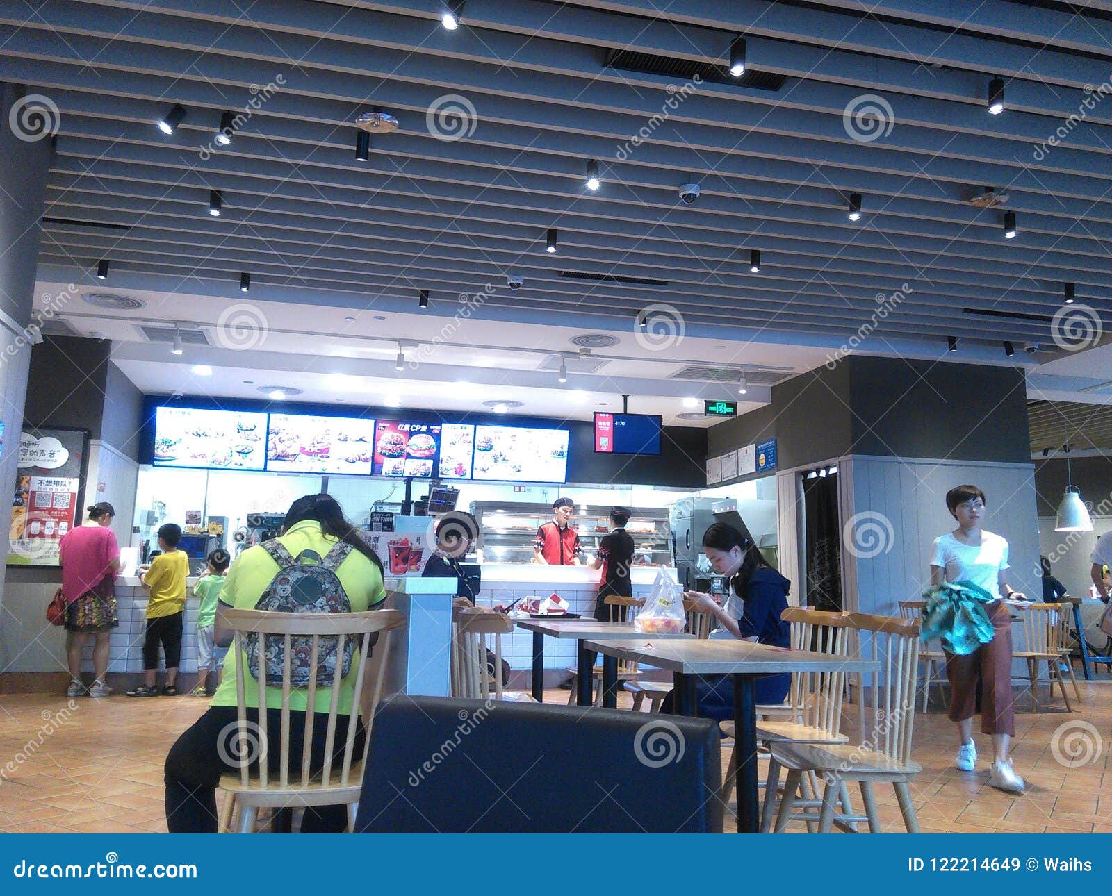 Shenzhen, China: the indoor scenery of KFC restaurant, people enjoy delicious food. KFC restaurant indoor landscape, people are enjoying delicious food, children and women.