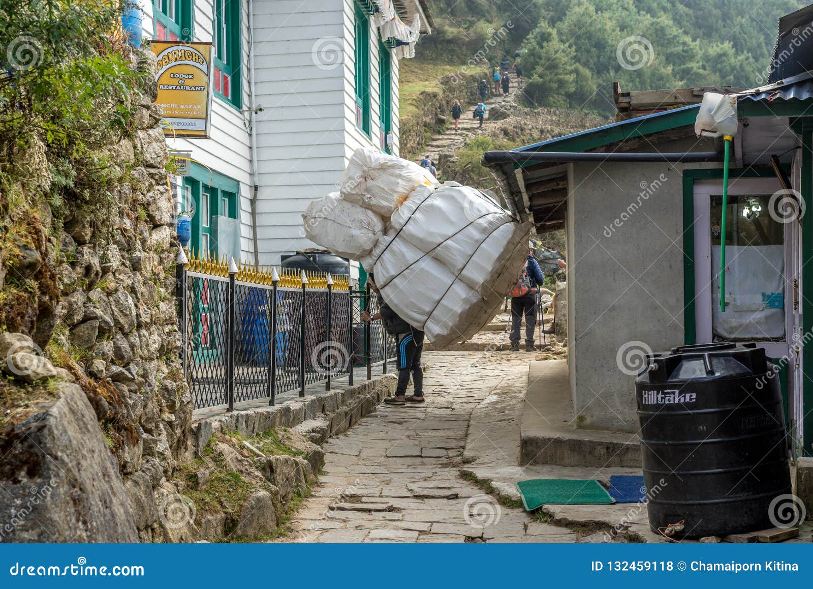 Sherpa Porters Carrying Heavy Sacks in the Himalayas at Everest